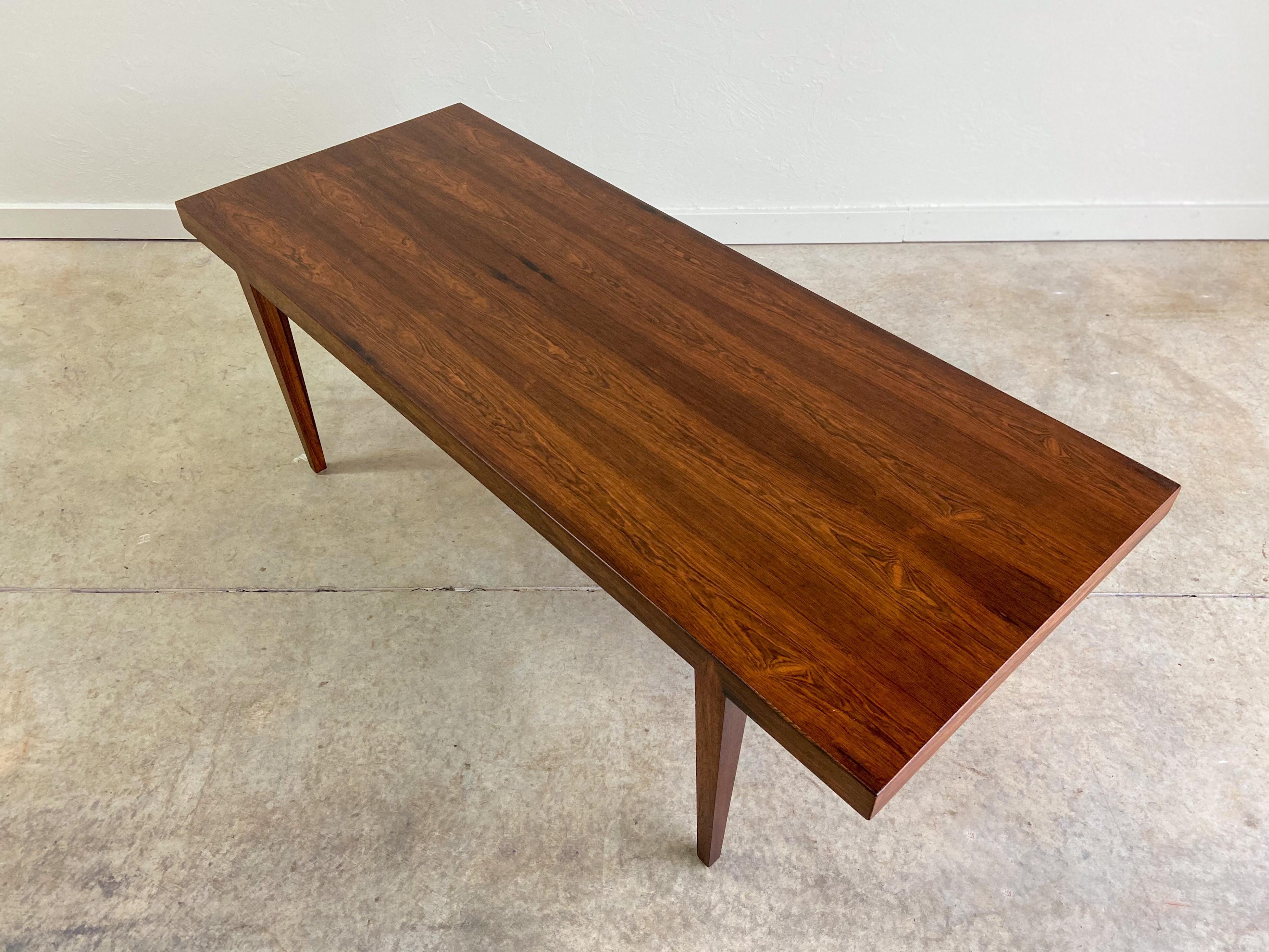 A rosewood coffee table designed by Severin Hansen. A great example of minimalist Danish modern design. Table features lovely grain and beautiful joinery.

Lower shipping rates available.
