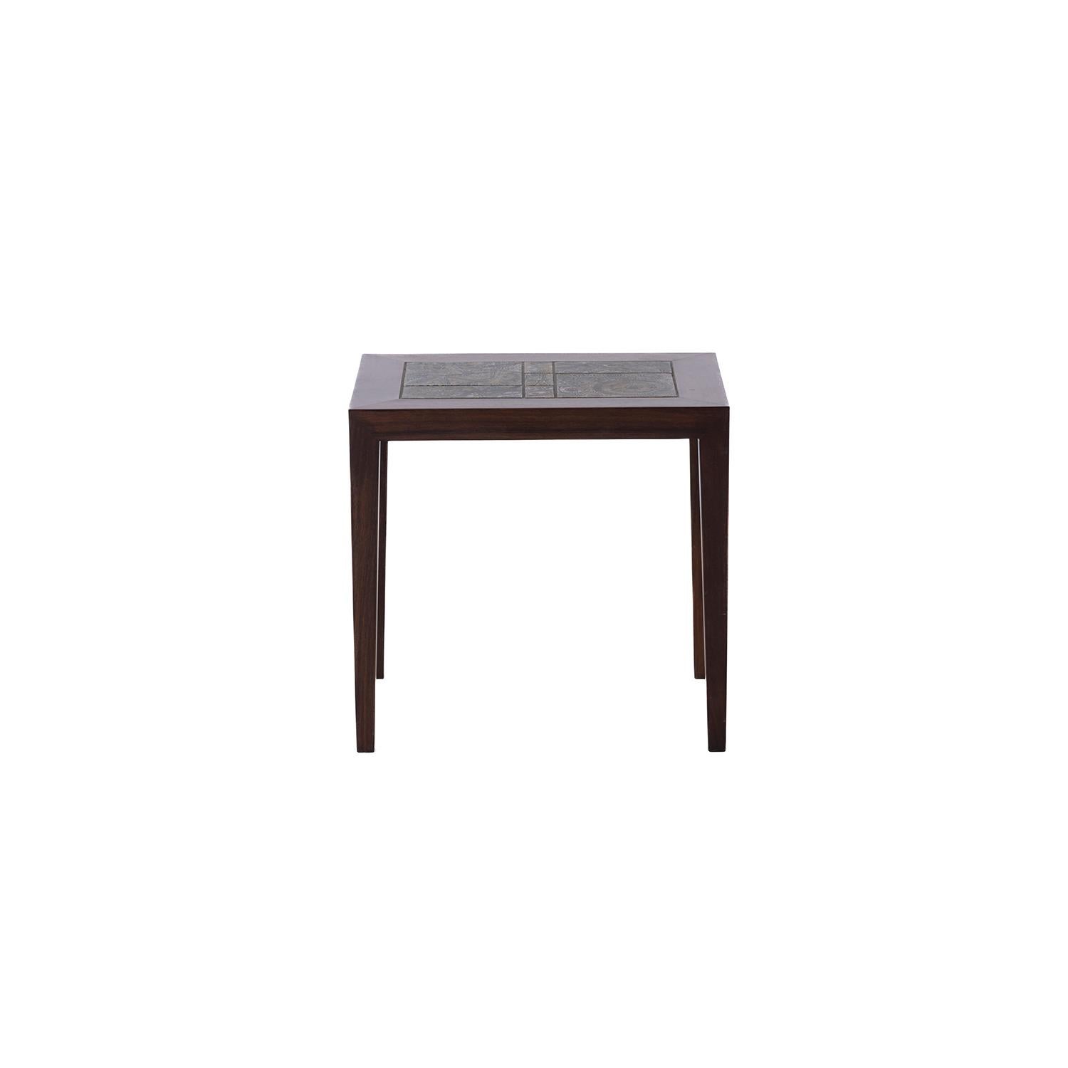 Danish modern rosewood occasional table designed by Severin Hansen. Inlayed with Royal Copenhagen tile designed by Nils Thorsson. 



Professional, skilled furniture restoration is an integral part of what we do every day. Our goal is to provide