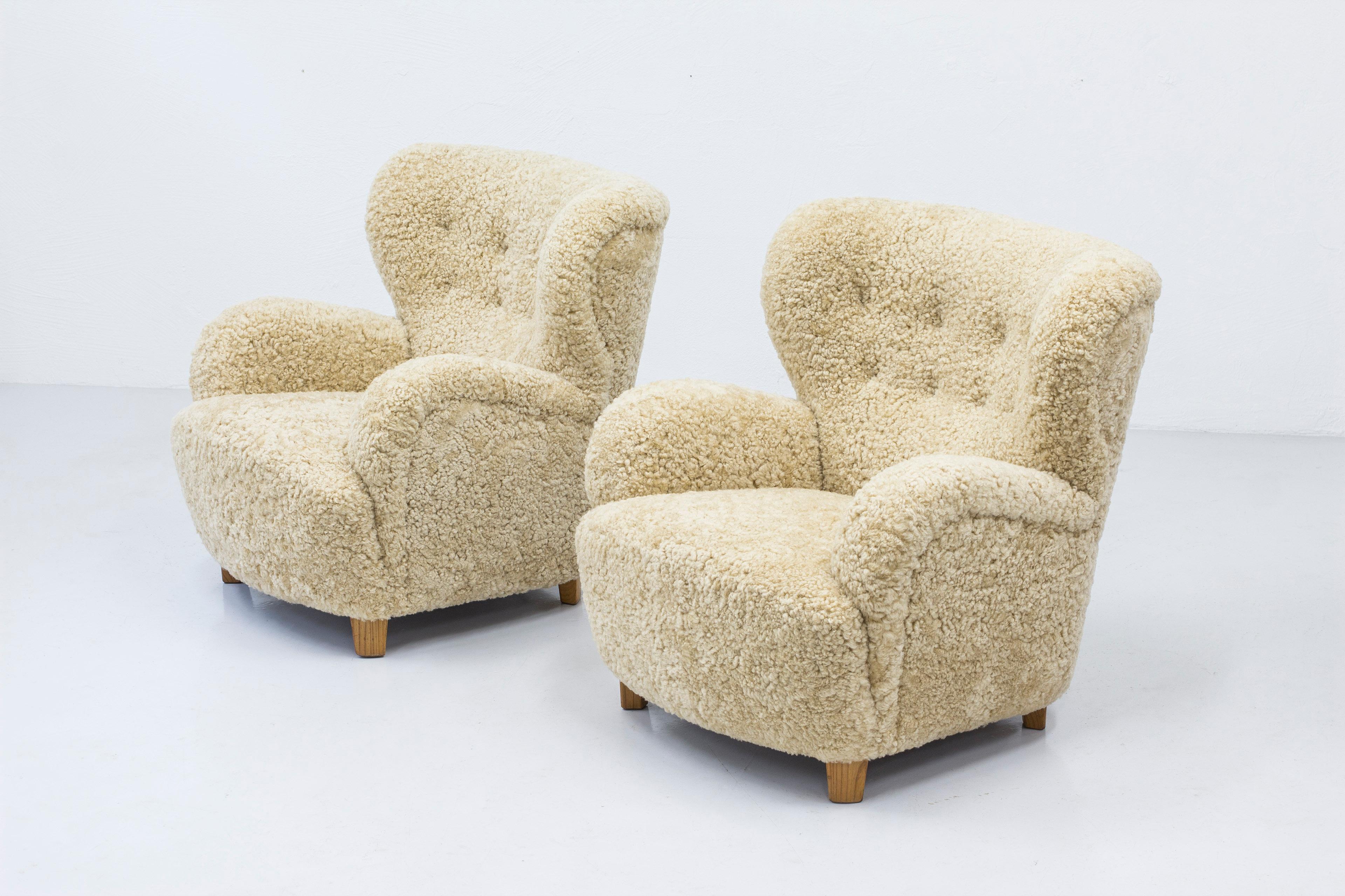 Danish modern sheepskin lounge chairs in the style of Flemming Lassen 5