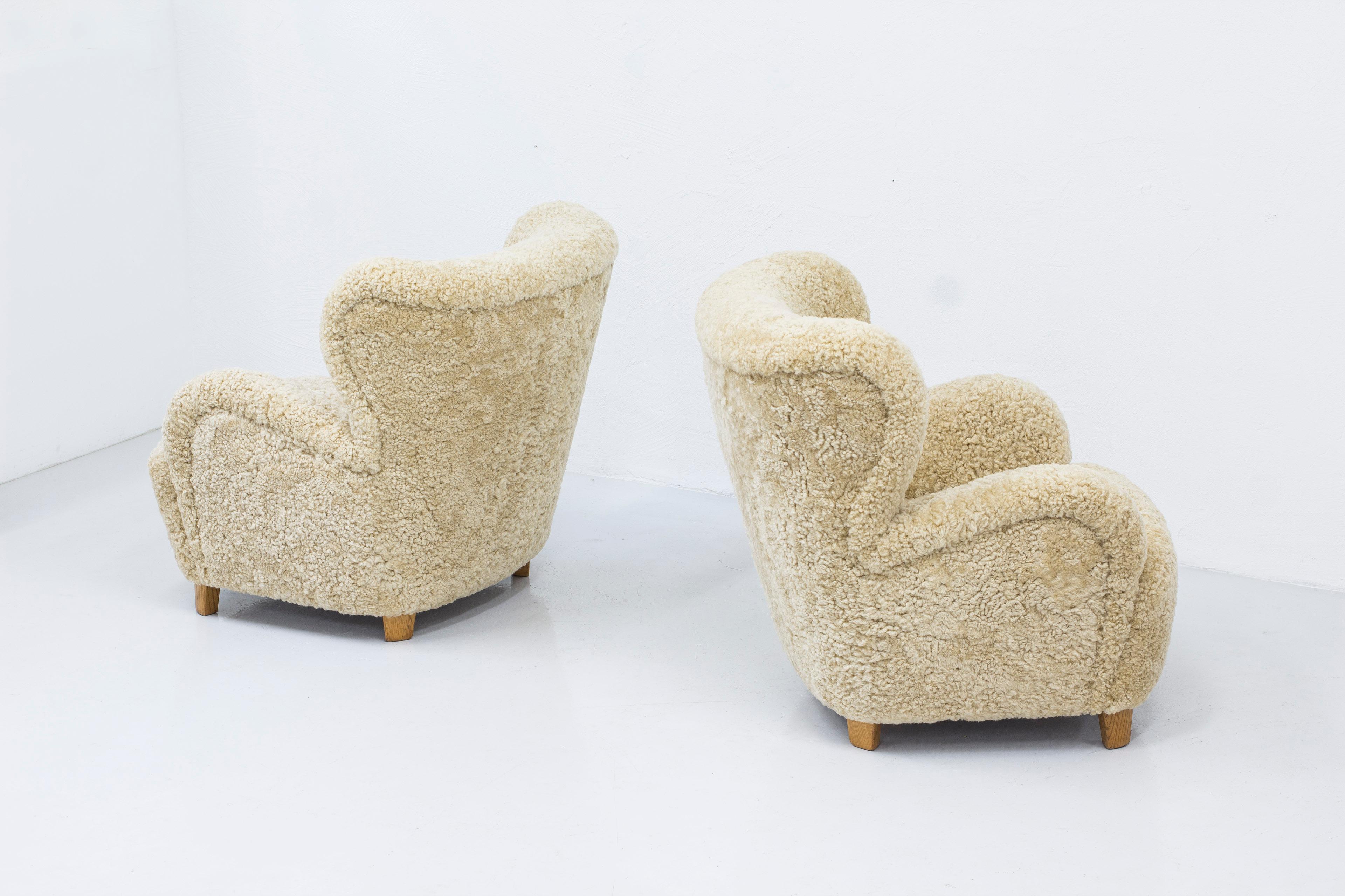Danish modern sheepskin lounge chairs in the style of Flemming Lassen 6