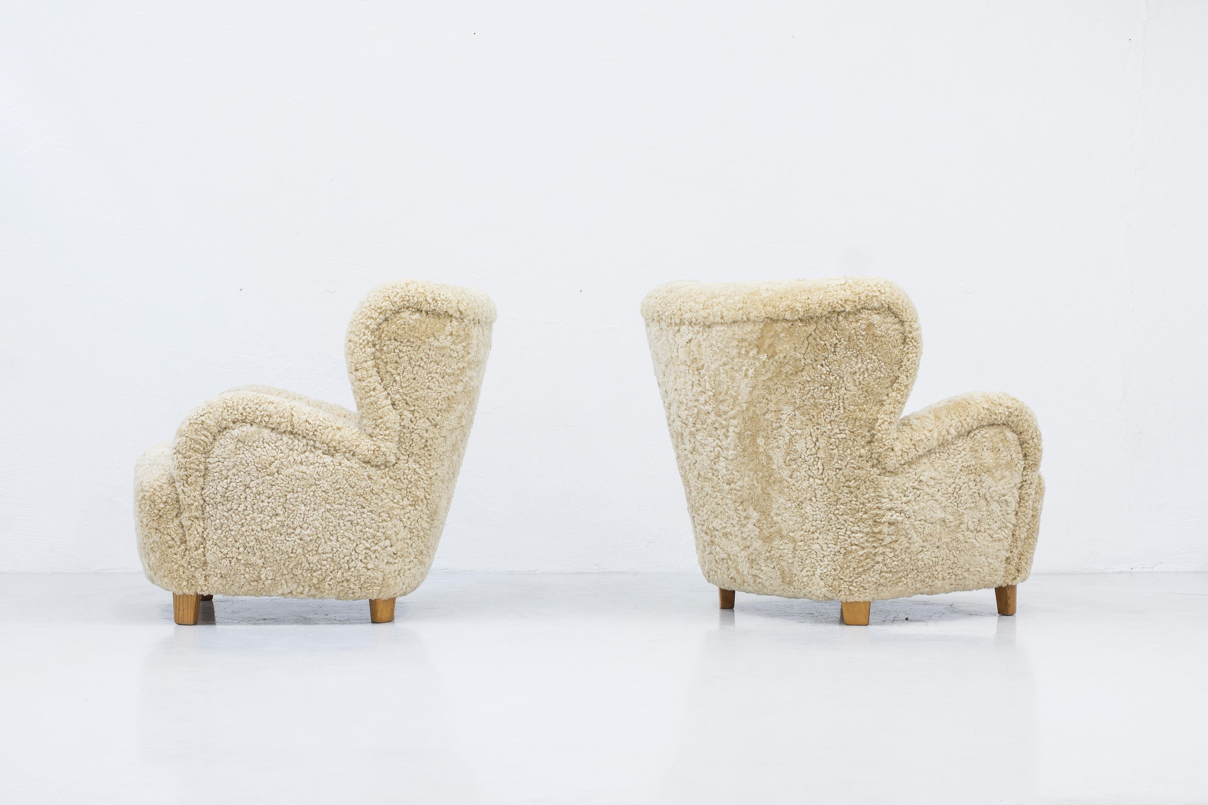 Danish modern sheepskin lounge chairs in the style of Flemming Lassen 7