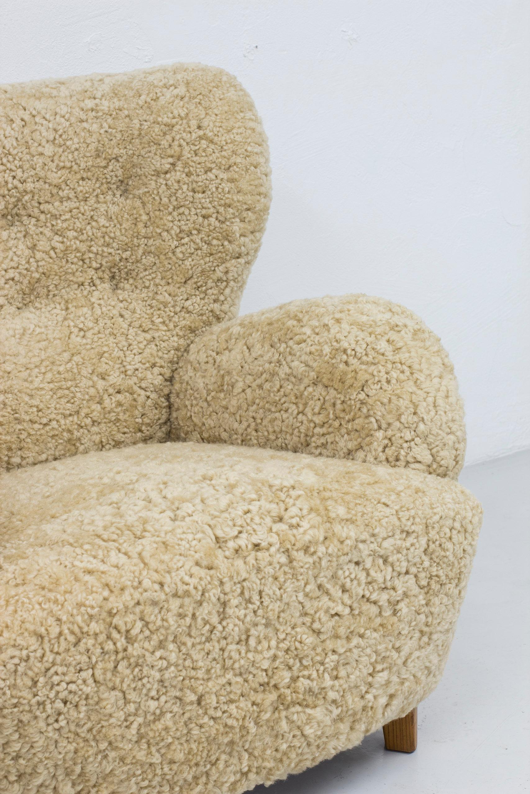 Danish modern sheepskin lounge chairs in the style of Flemming Lassen 2