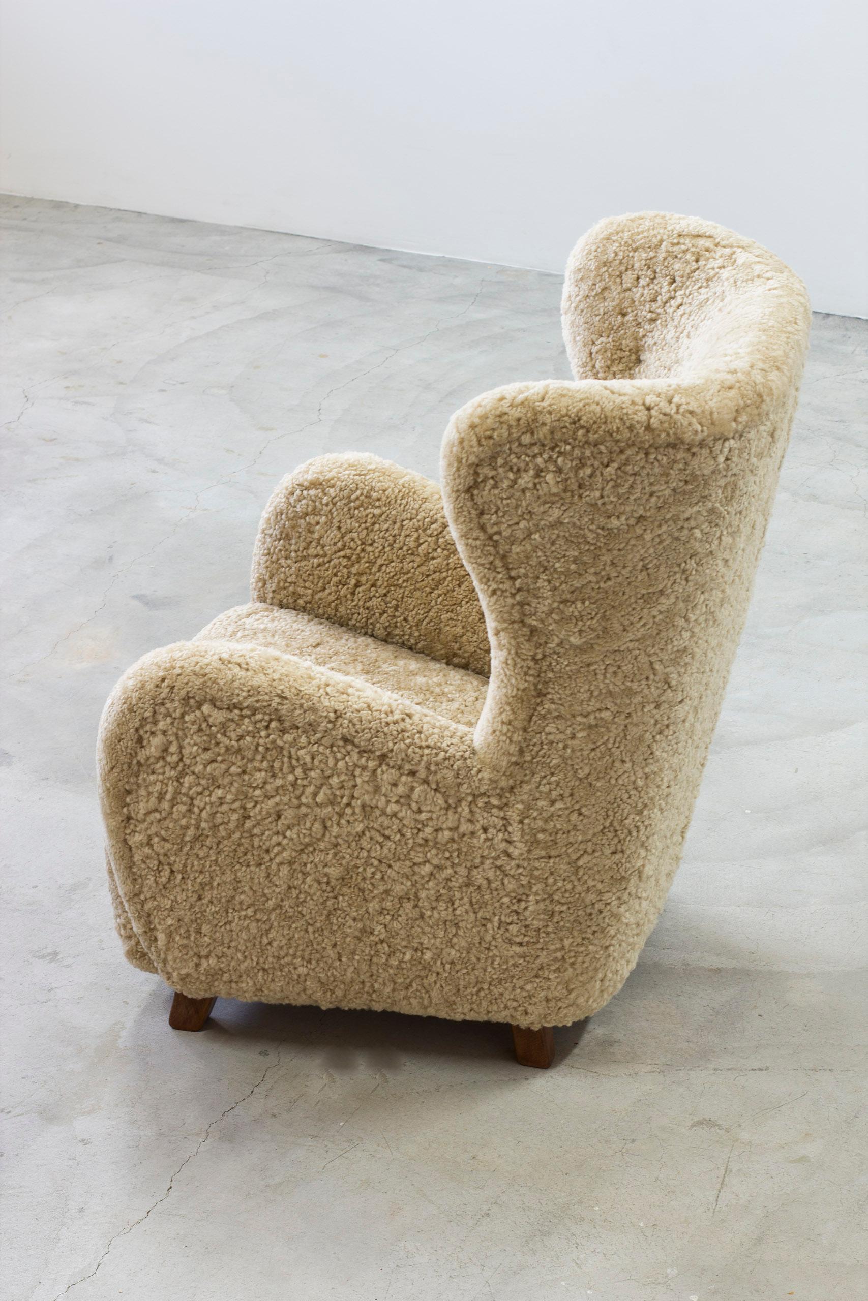 Scandinavian Modern Danish modern sheepskin Wing back chair in the style of Lassen, Denmark