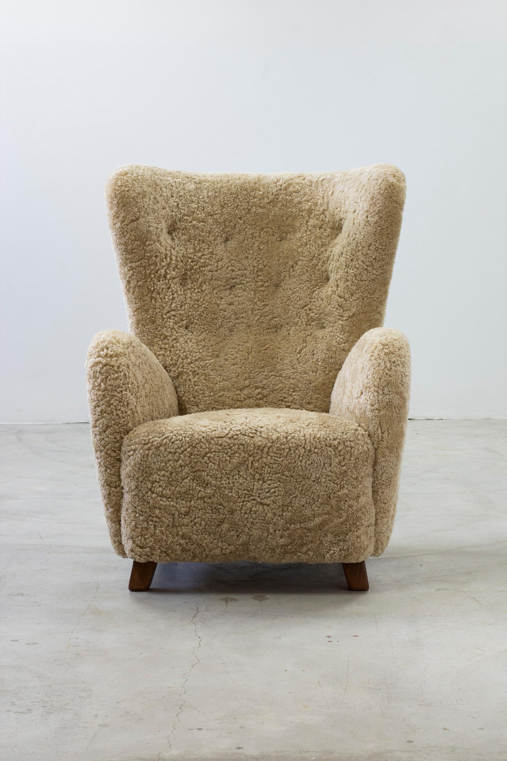 Mid-20th Century Danish modern sheepskin Wing back chair in the style of Lassen, Denmark