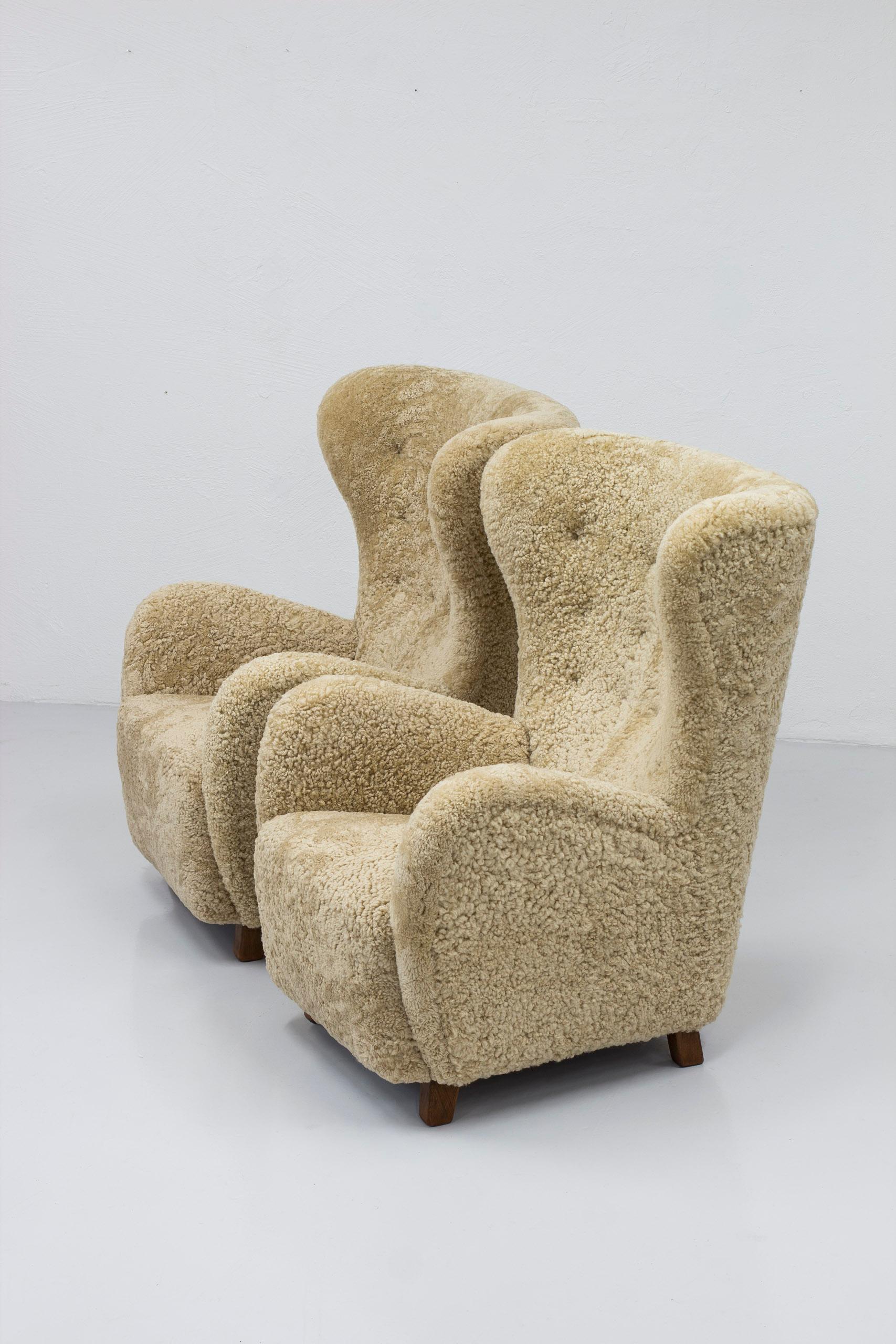 Scandinavian Modern Danish modern sheepskin Wing back chairs attributed to Flemming Lassen, Denmark  For Sale