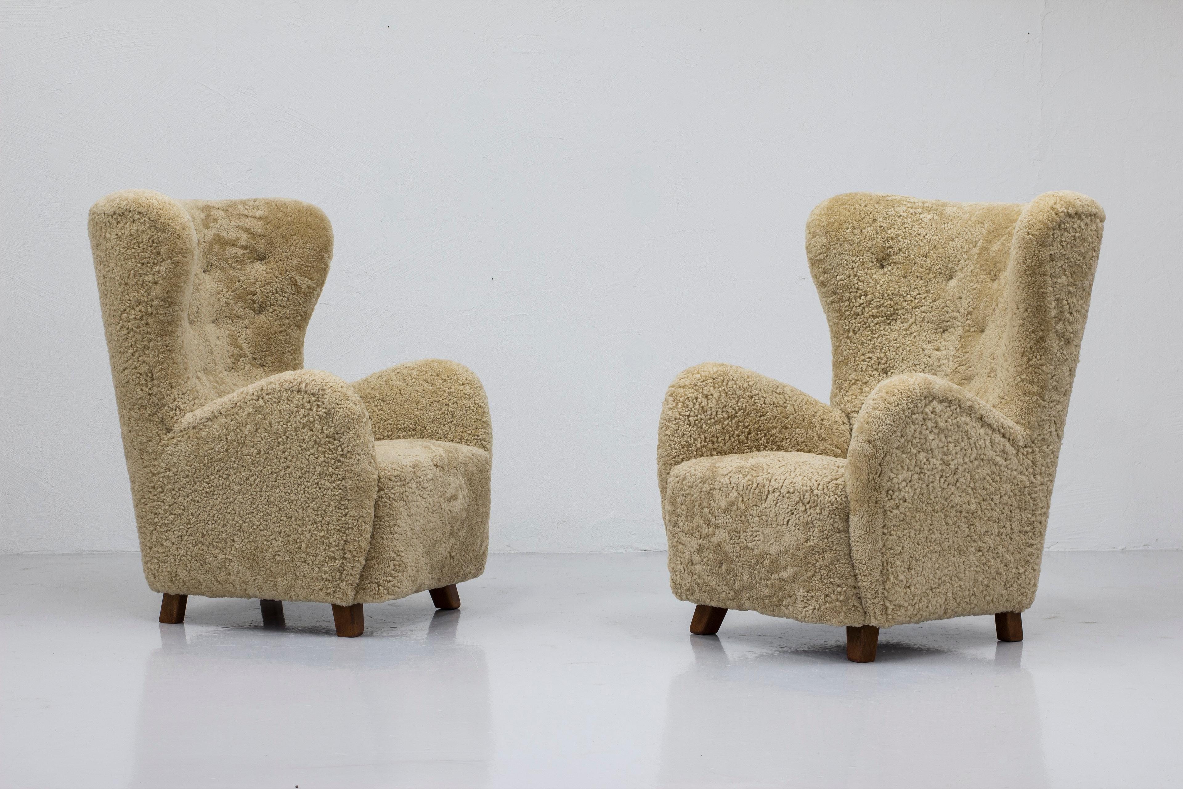 Mid-20th Century Danish modern sheepskin Wing back chairs attributed to Flemming Lassen, Denmark  For Sale