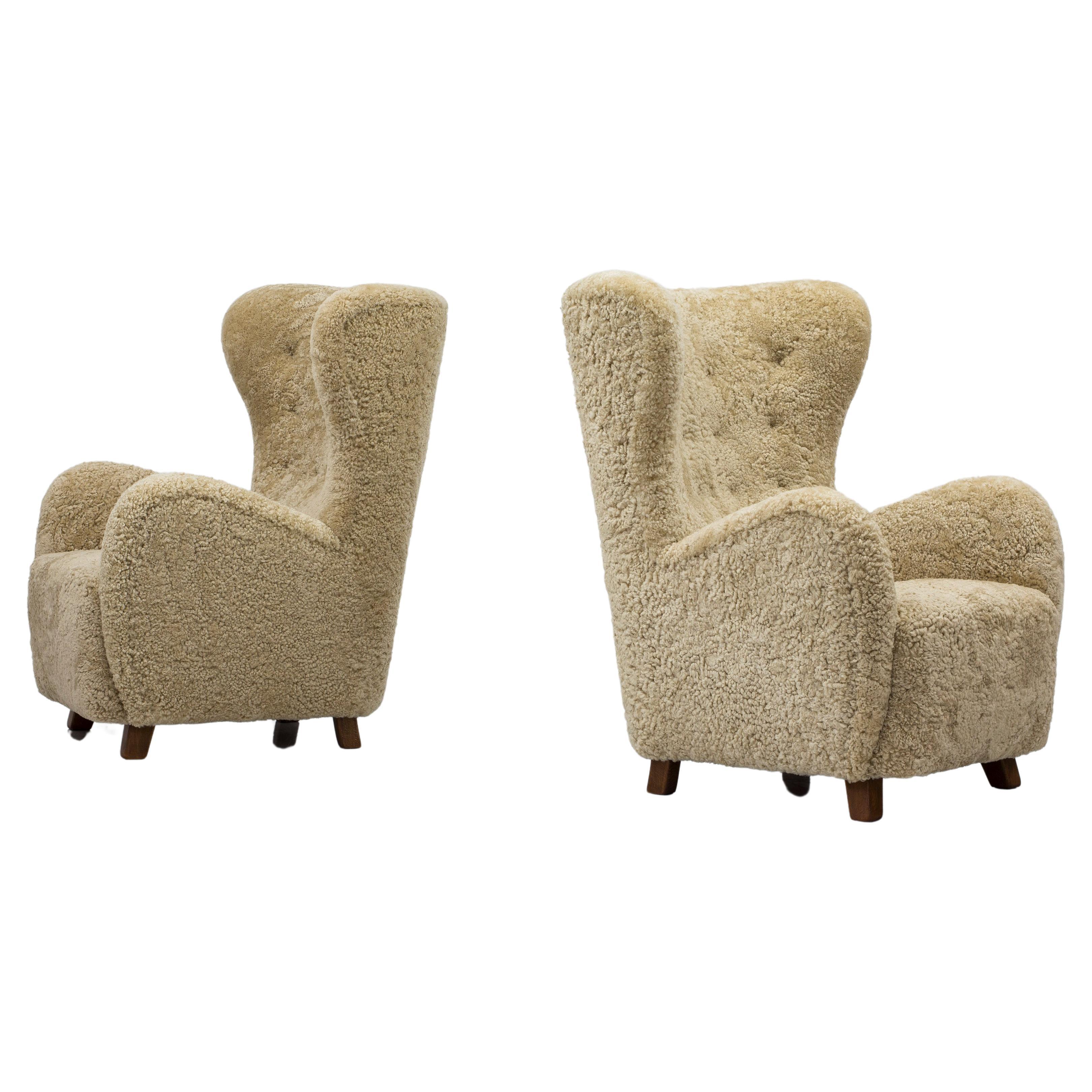 Danish modern sheepskin Wing back chairs attributed to Flemming Lassen, Denmark 