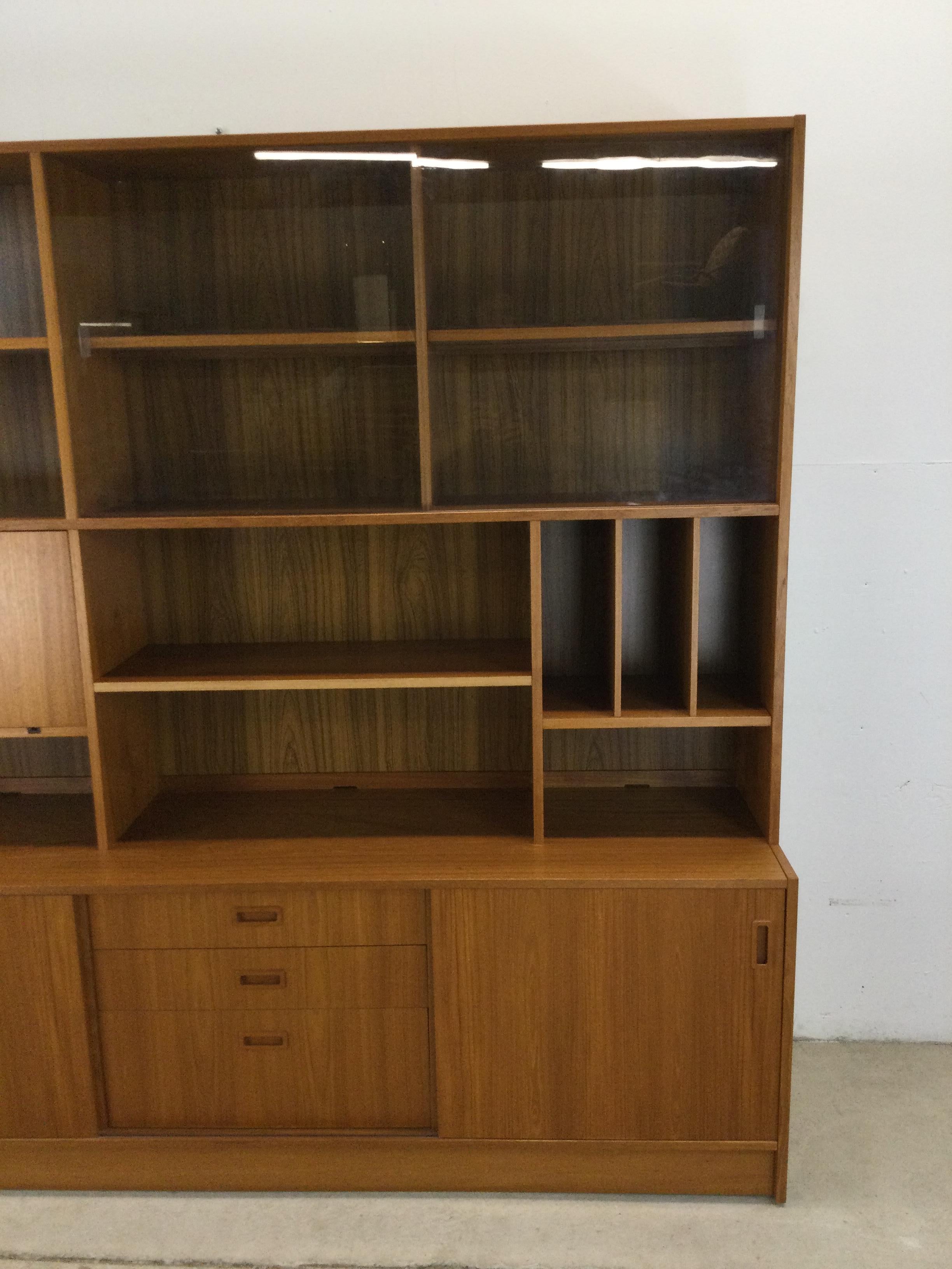 20th Century Danish modern shelving unit with sliding glass doors and drop front cabinet