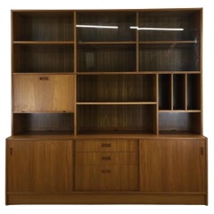 Danish modern shelving unit with sliding glass doors and drop front cabinet