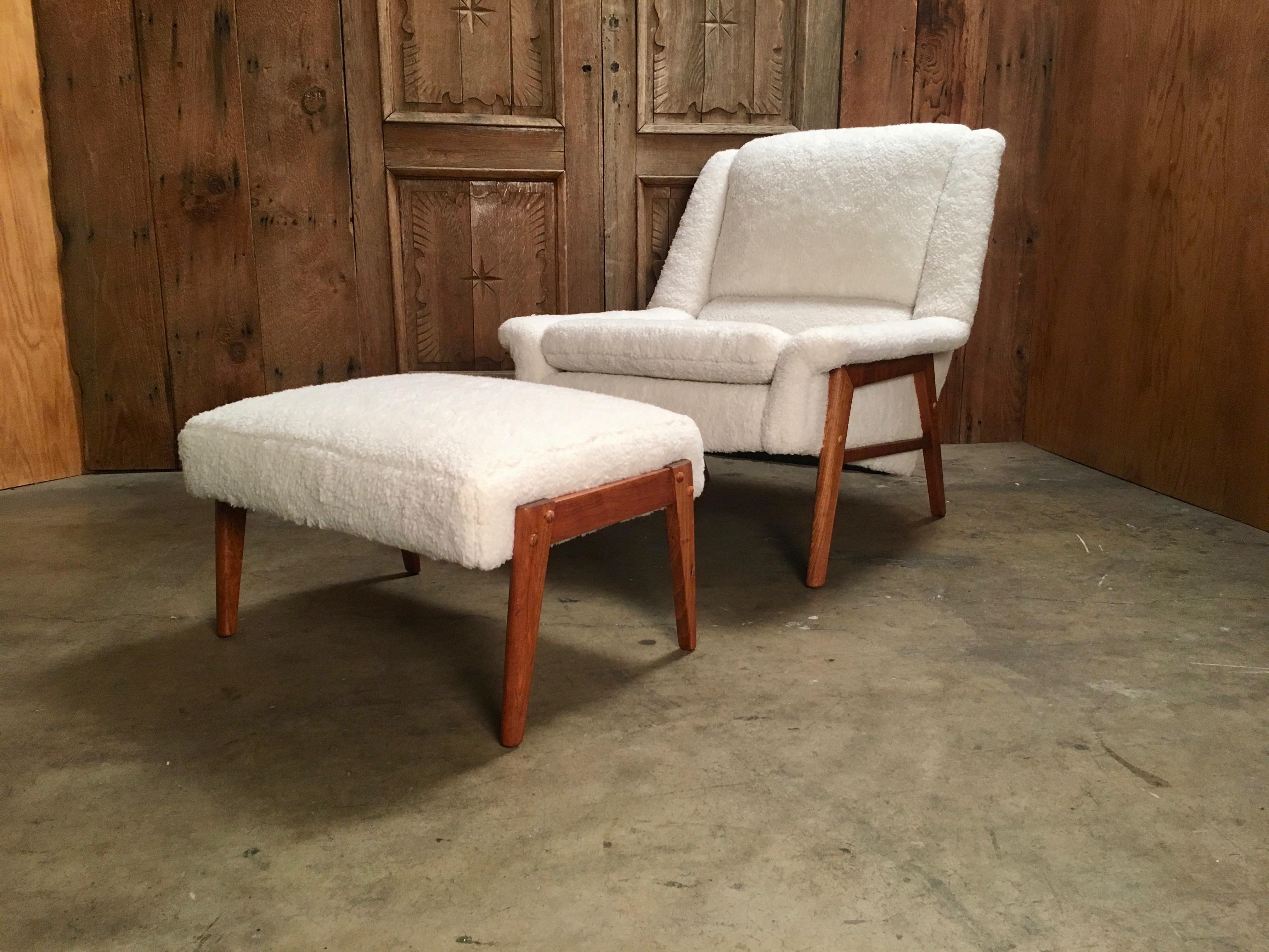 Danish modern oak frame lounge chair and ottoman in the style of Folke Ohlsson. Newly reupholstered in very comfortable Ivory sherpa teddy bear fabric. 

Ottoman Measures: 15.5 H x 27 L x 20 D.