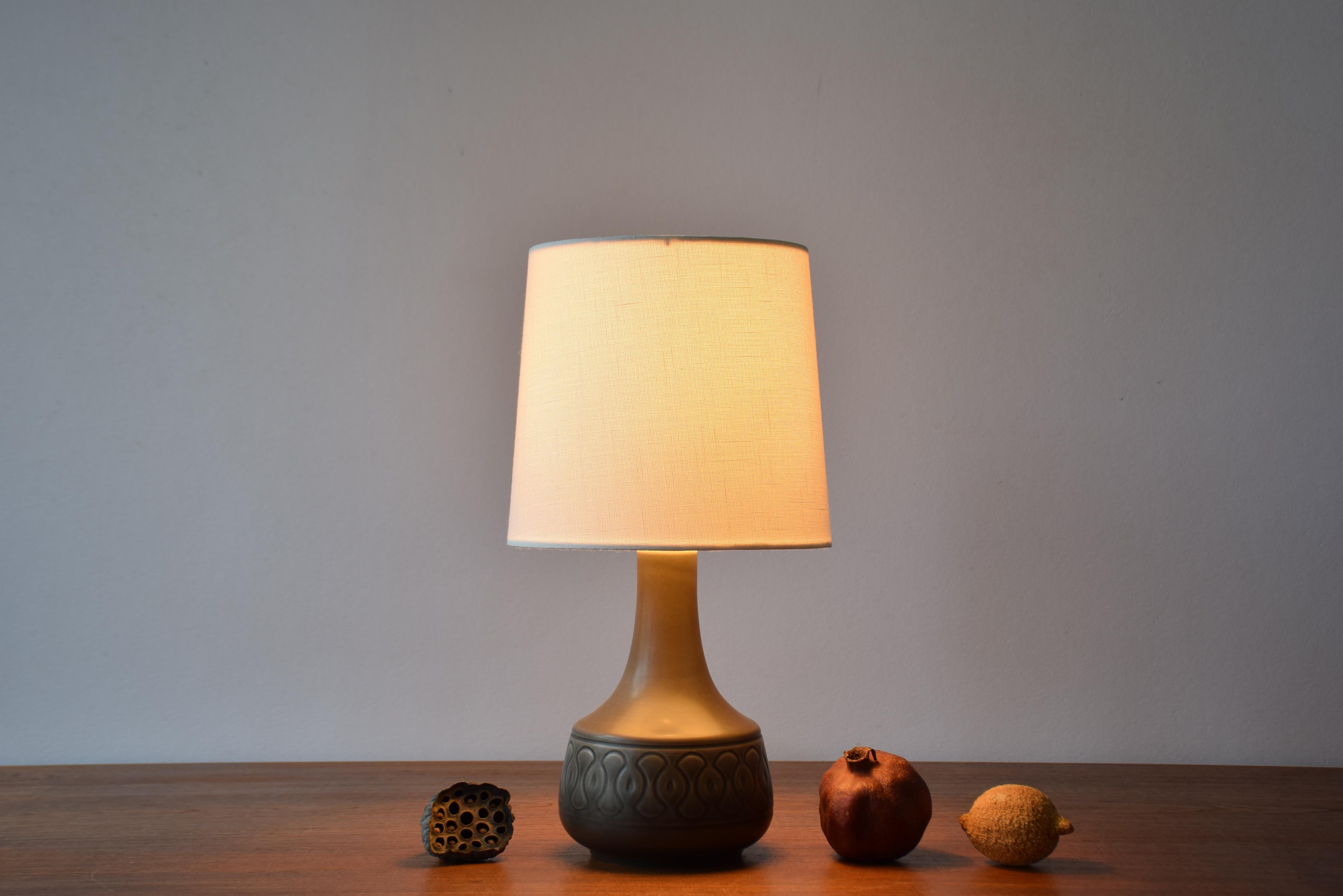 Small ceramic table lamp from the ceramic manufacturer Søholm Stentøj, Denmark, made circa 1960s. It's most likely designed by Einar Johansen.

Perfect as a bedside lamp.

The lamp has dusted brown glaze.

Included is a new clip on bulb lamp shade