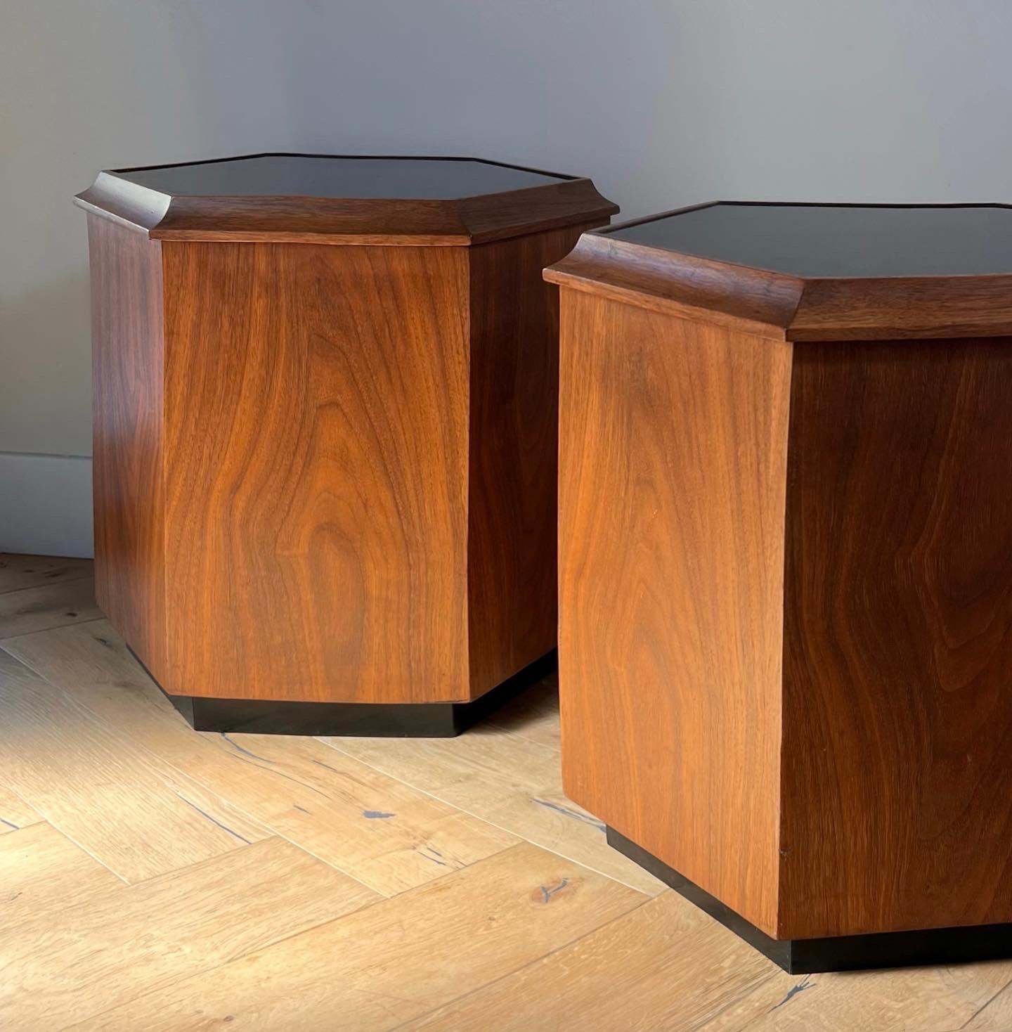 A pair of hexagonal Danish modern side tables or nightstands, 1960s. With ebonized tops and plinths, and featuring ample storage. Minor signs of age but overall fabulous condition. Pick up in central west Los Angeles or worldwide shipping