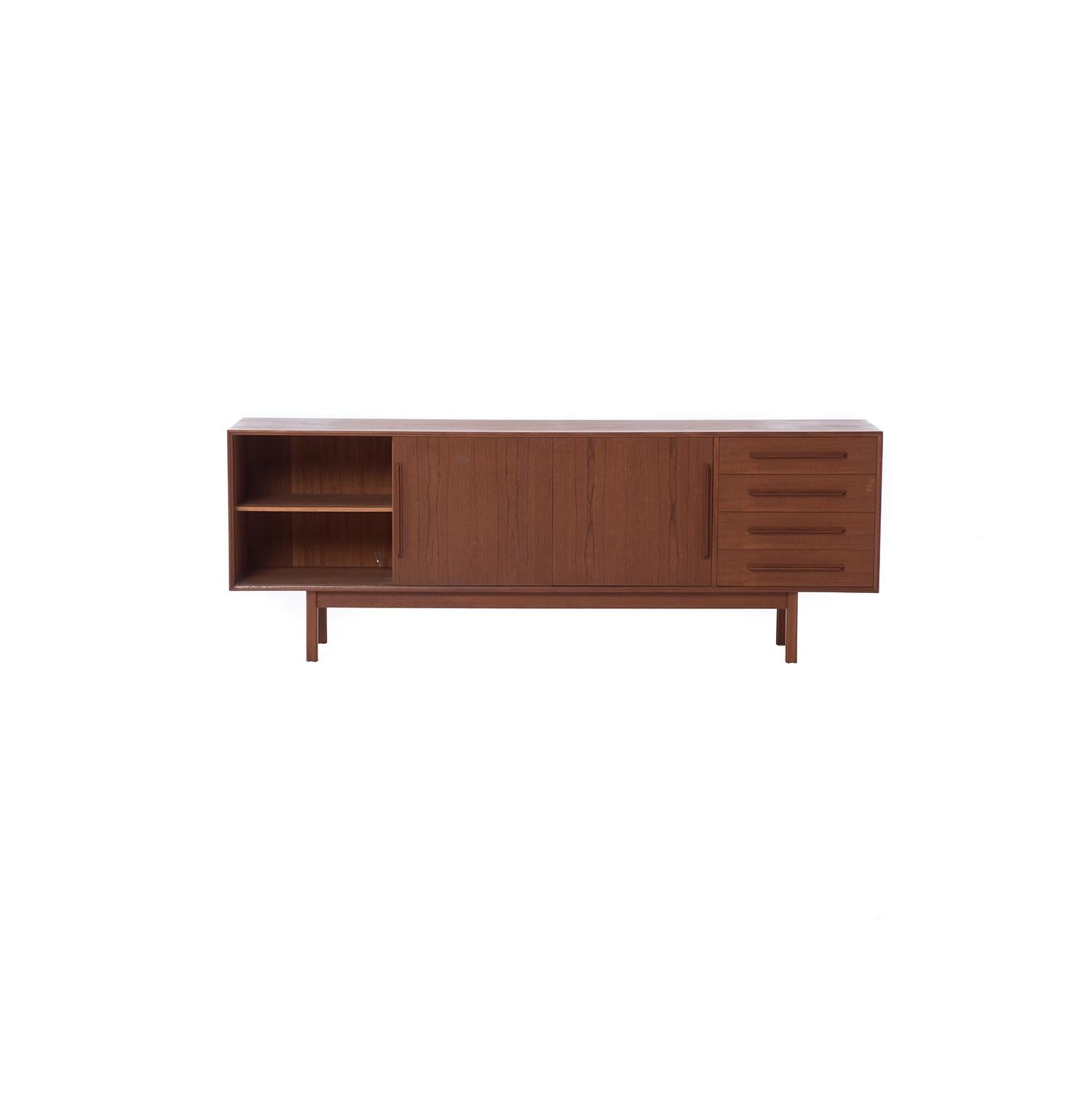 This teak sideboard features three sliding doors and four drawers atop squared legs.