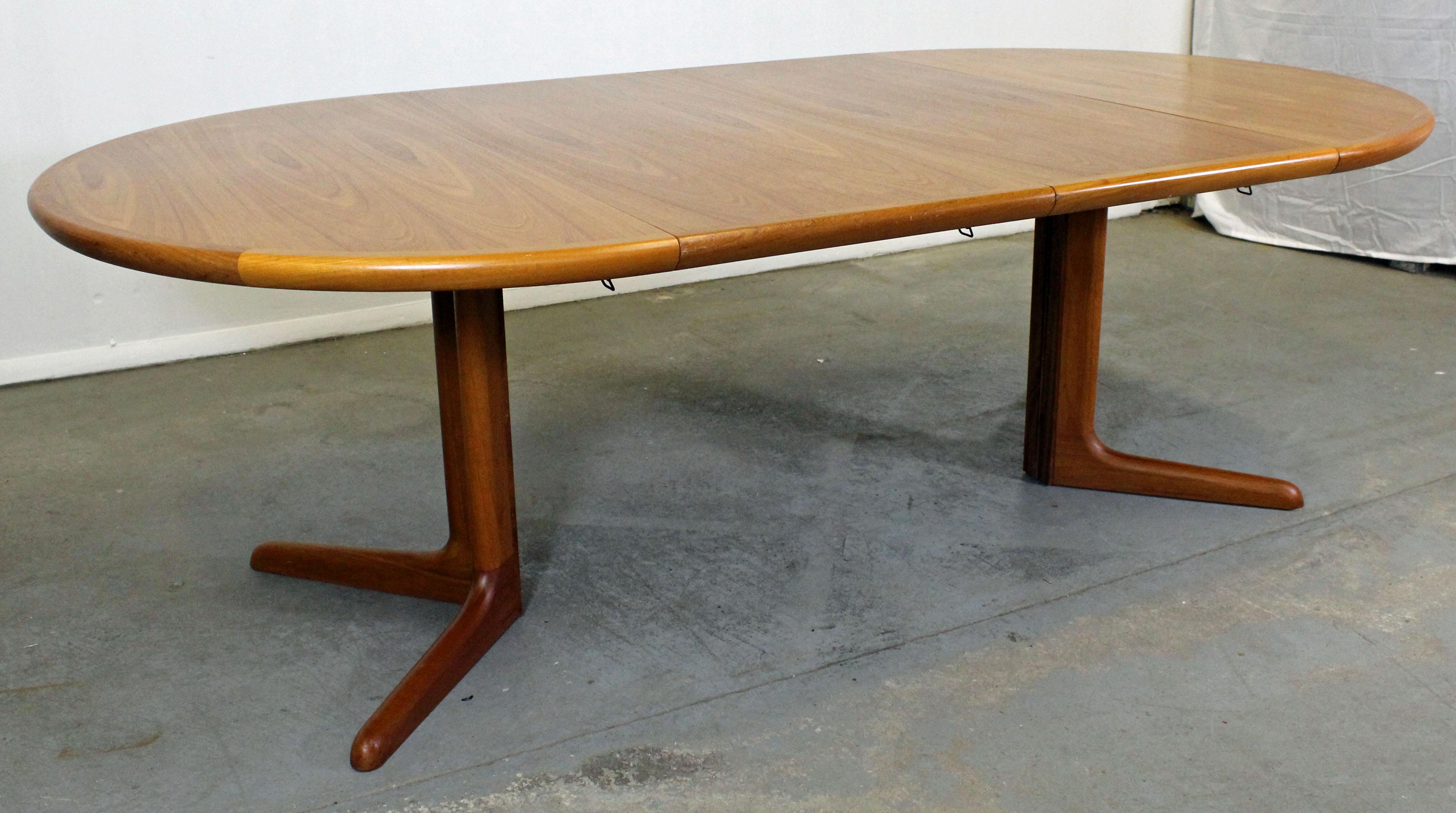 What a find. Offered is a Danish modern round extendable teak dining table made by Skovby. Includes two table leaves/extension boards. It is in good condition, showing slight age wear. It is marked by Skovby.

Approximate dimensions:
With