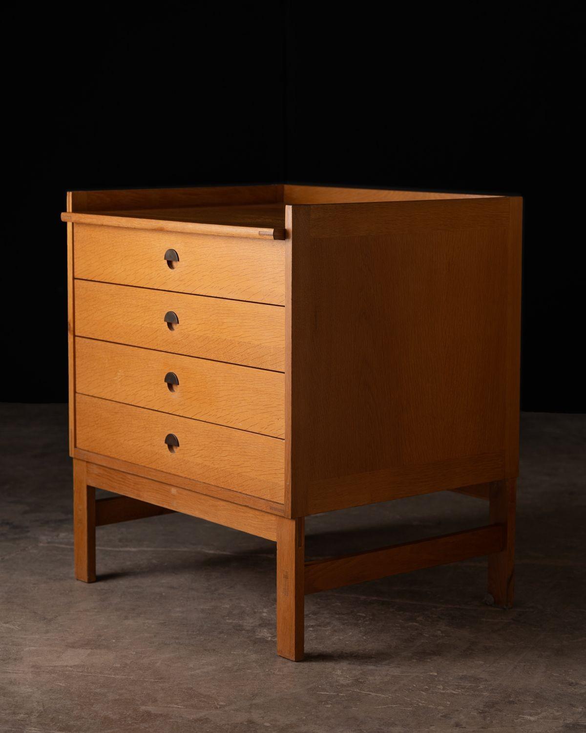 This rare Danish modern cabinet was designed by renowned scandinavian architects Ilse & Ove Rix for Uldum Møbelfabrik in 1961. The solid wood construction is remarkable. The entire cabinet was crafted using mortise & tenon joinery and the drawers