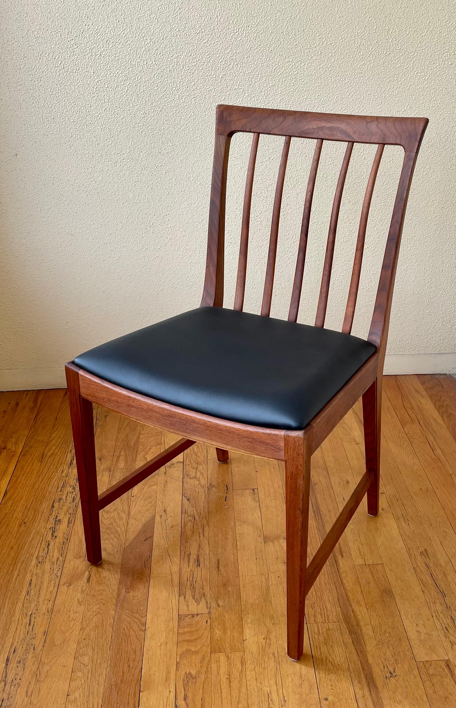 Beautiful elegant single desk chair in solid walnut sculpted frame, with freshly upholstered in black Naugahyde, solid sturdy we have restored the frame it's in very nice condition, circa 1950s. Made in Sweden by Moreddi.