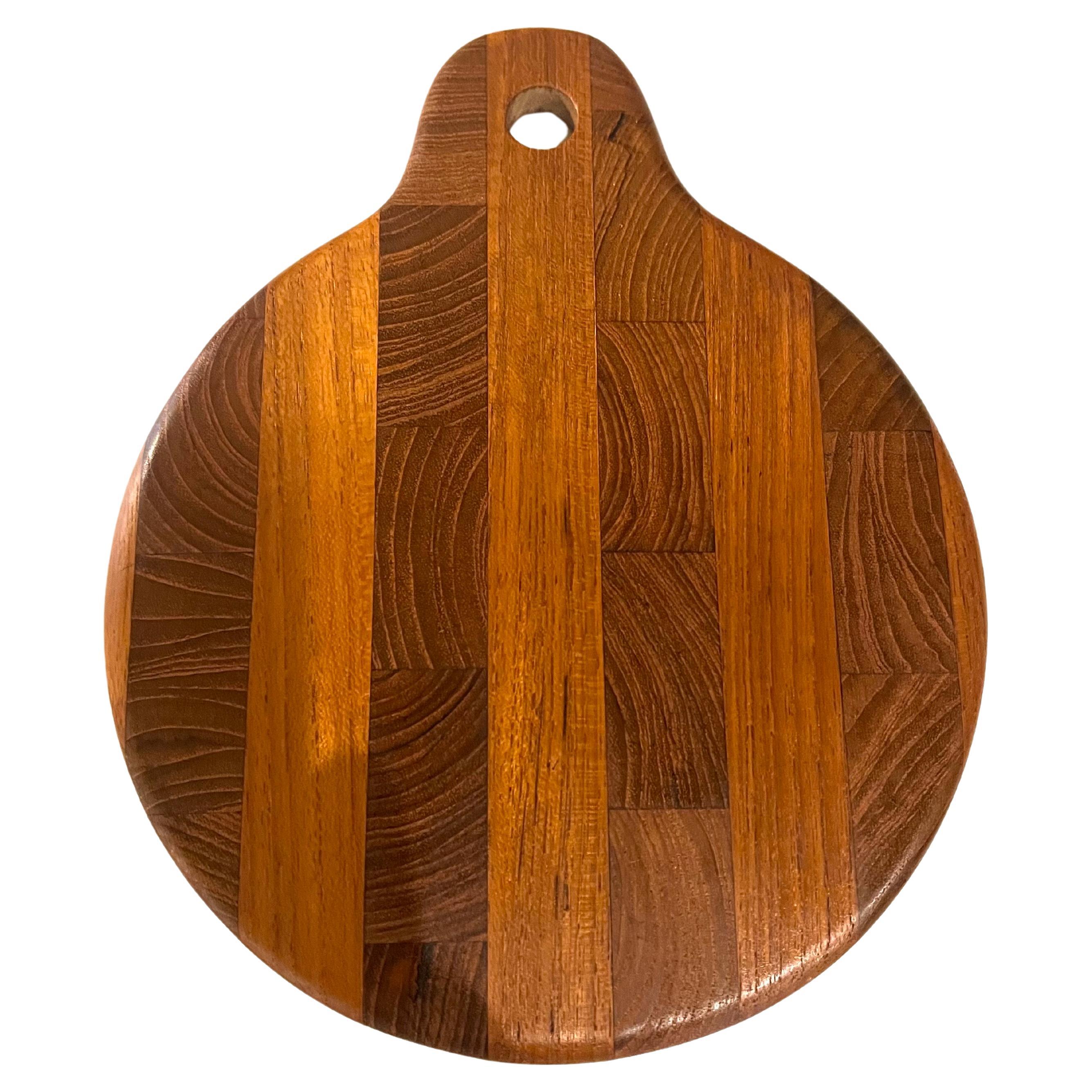 Petite solid teak butcher block serving tray great for cheese & crackers , elegant simple design easy to store or hang in the wall.
