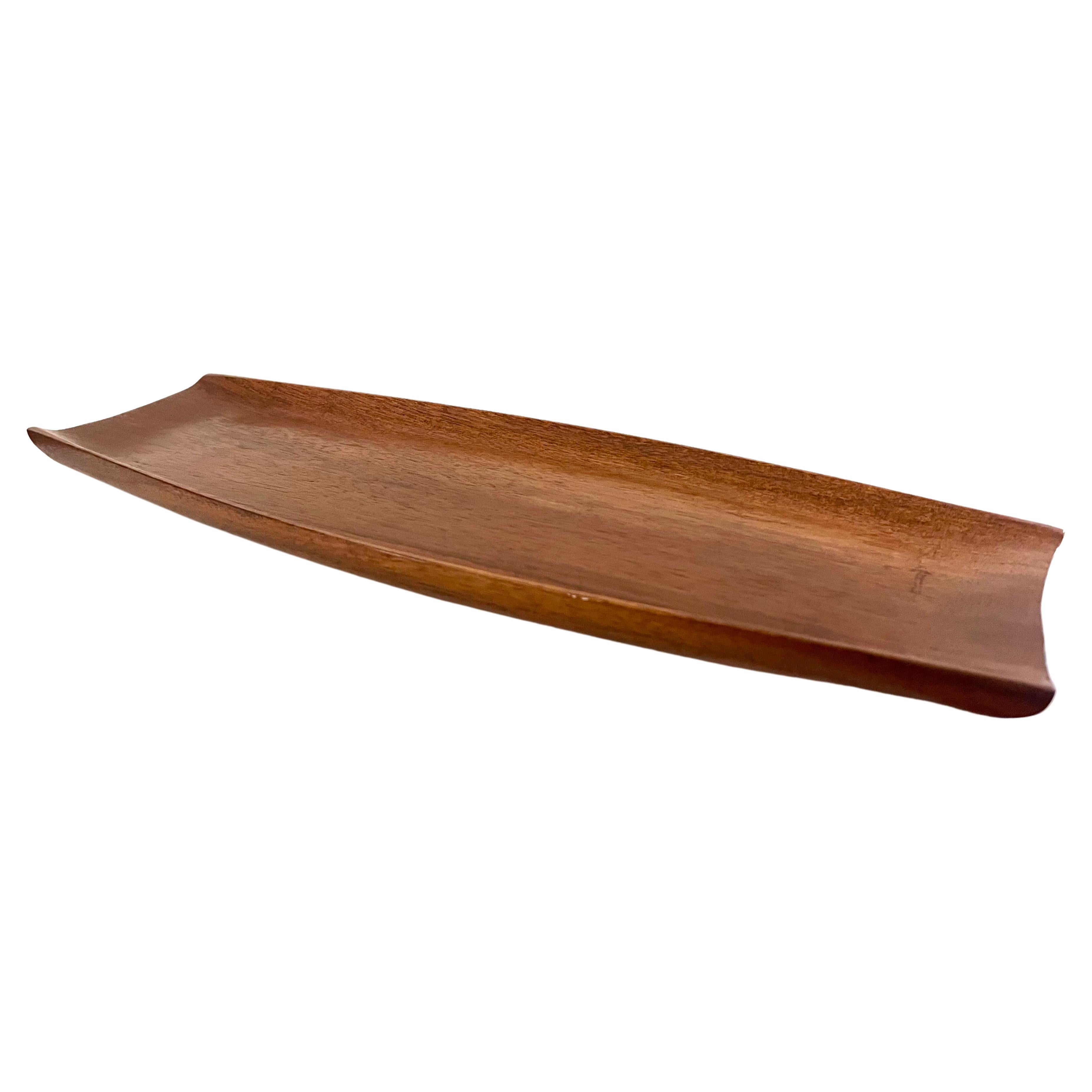 Beautiful shape and form on this solid teak hand-carved tray, nice raised edge, and very nice condition, great for Catch it all use or fruit bowl.