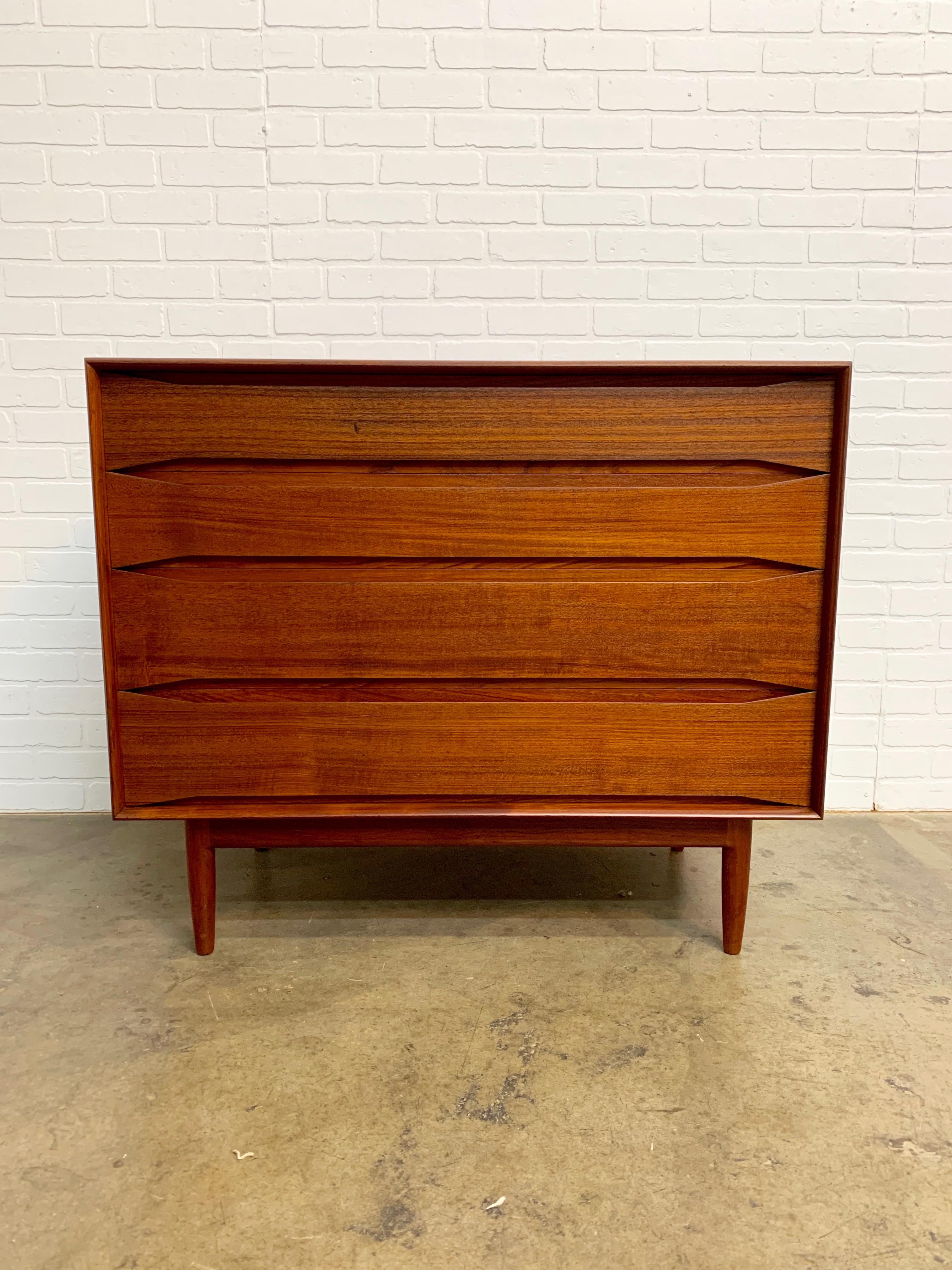 Solid teak dresser with exposed dovetail corners Designed by Johannes Aasbjerg for his company Aasbjerg & Ørtoft. Johannes Aasbjerg's Classic bullet edge case and recessed drawer pulls. Model EX-243 four-drawer dresser with a handcut dovetailed case