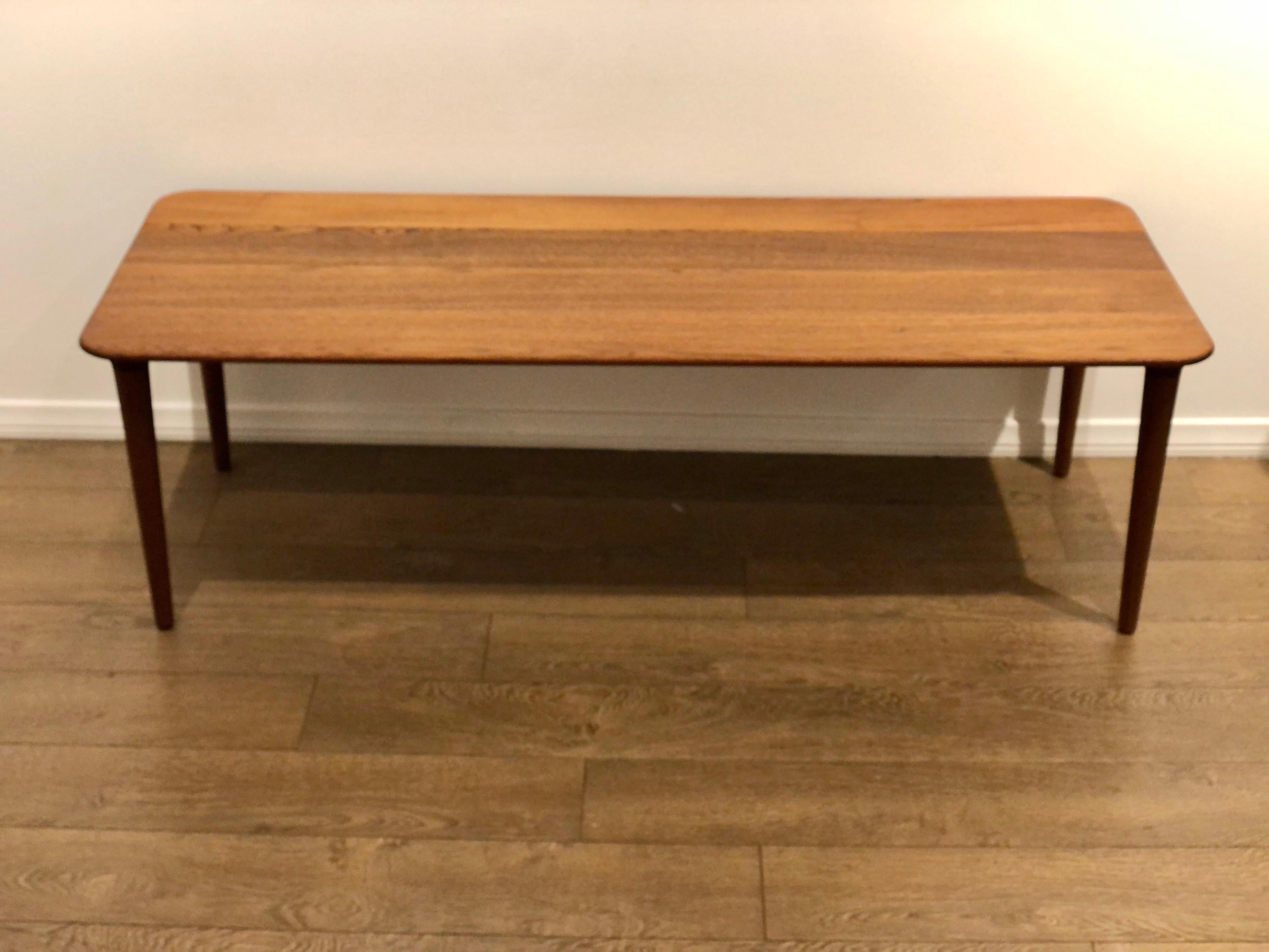 Beautiful solid teak coffee table designed by Rolf Rastad & Adolf Relling for Gustav Bahus, freshly refinished and oiled the legs are spectacular this table its simple and elegant the craftsmanship and quality are unique.