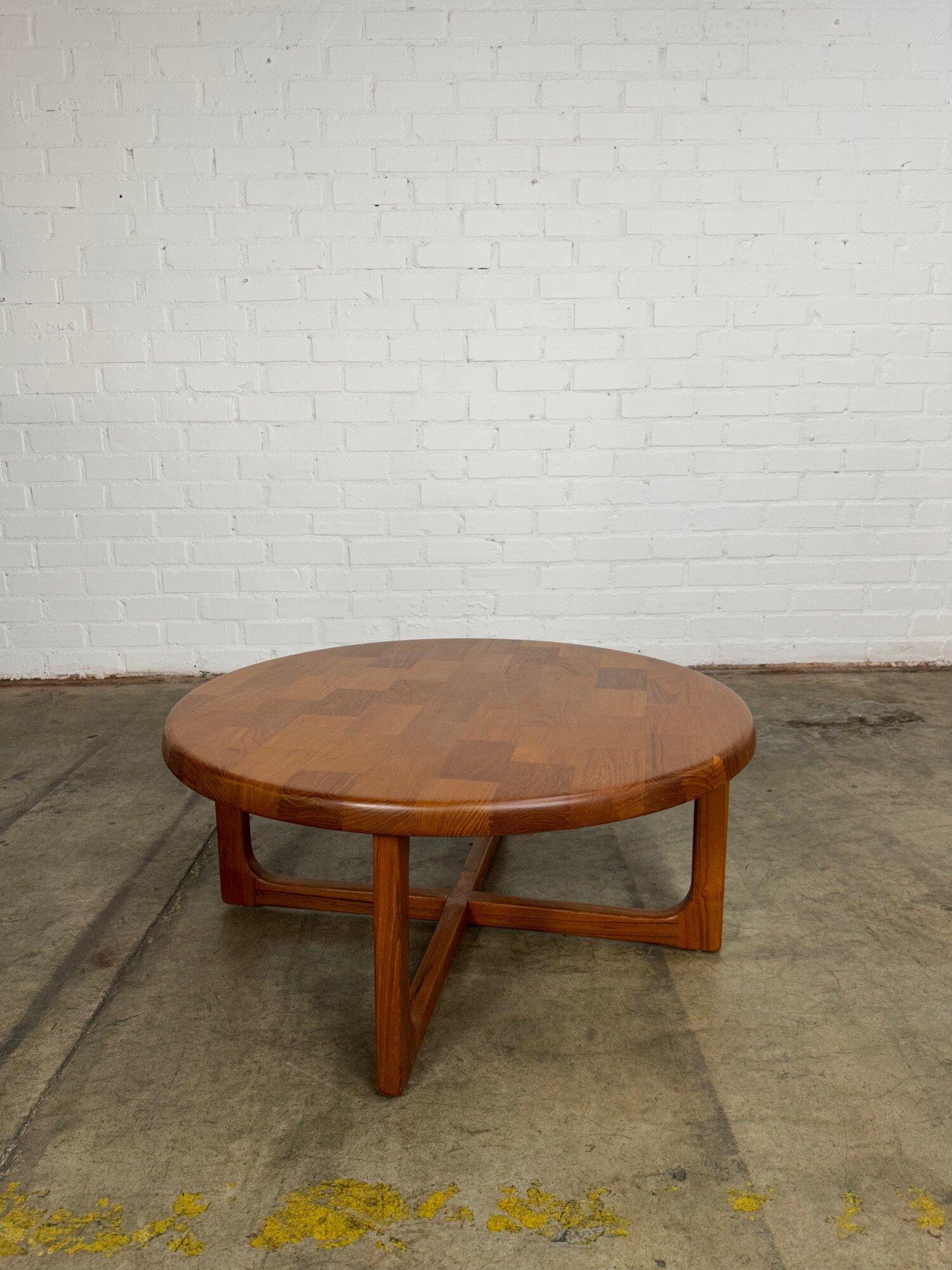 Measures: W38 H17

Fully restored coffee table with beautiful teal wood throughout in a patchwork layout with exposed joinery. This table is strong an sturdy with minimal signs of wear.