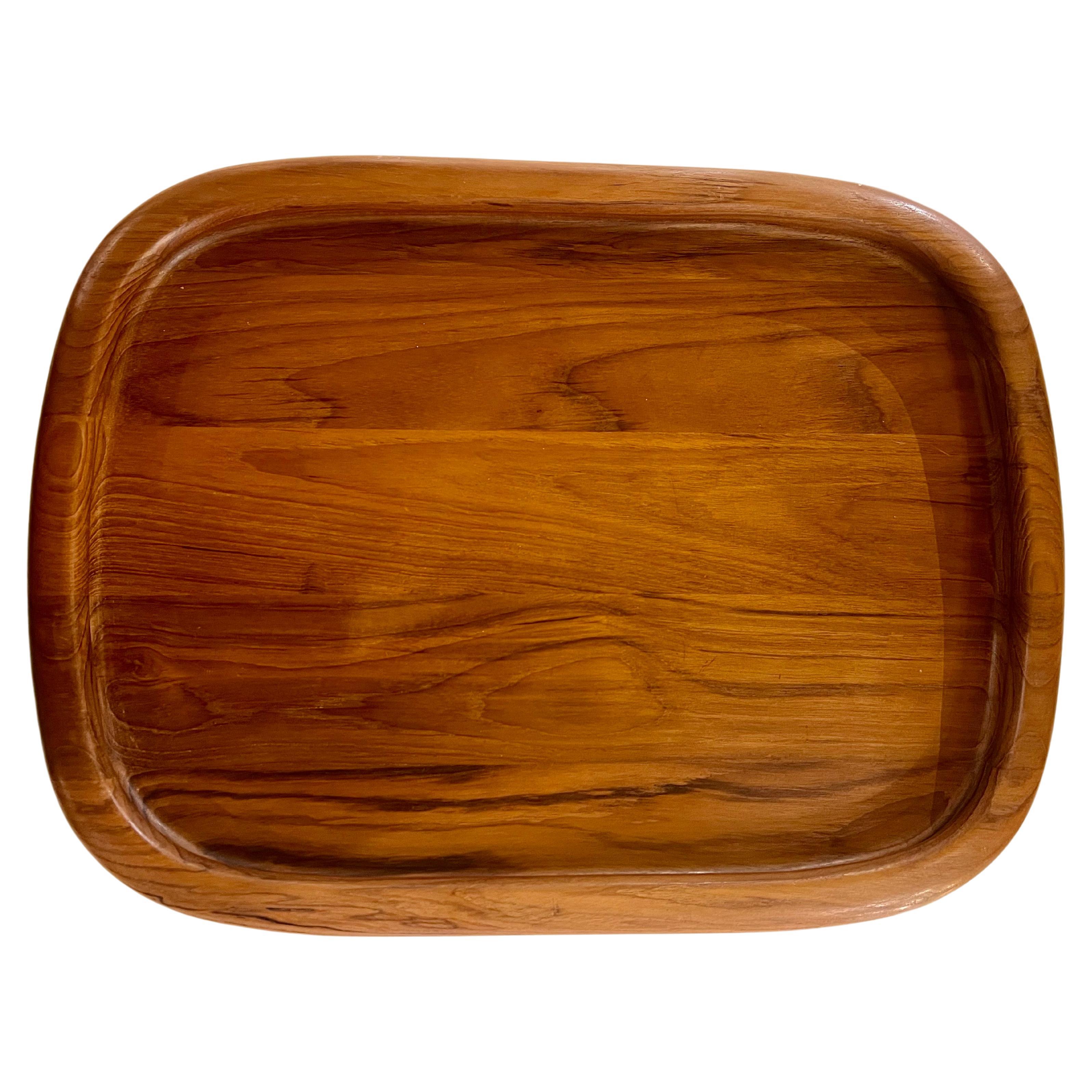Beautiful solid teak Dansk tray circa 1980's. designed by Quistgaard for Dansk nice round corners with raised edge stamped at the bottom , great condition a must for any danish Modern Mid Century home decor.
