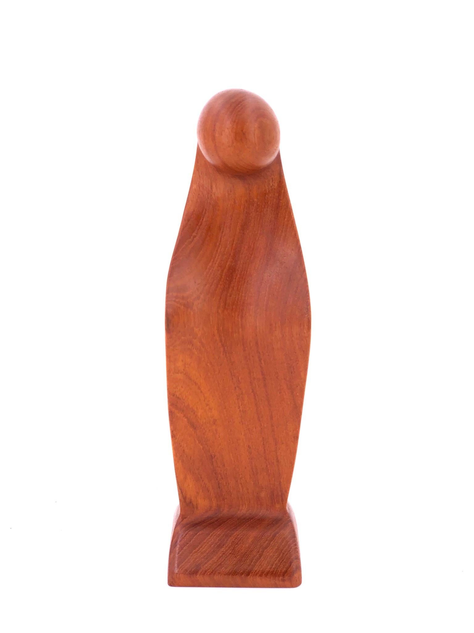 A beautiful modernist hand carved solid teak madona virgin sculpture, circa 1960's great condition, stamped at the bottom and signed but I can't read the designer.