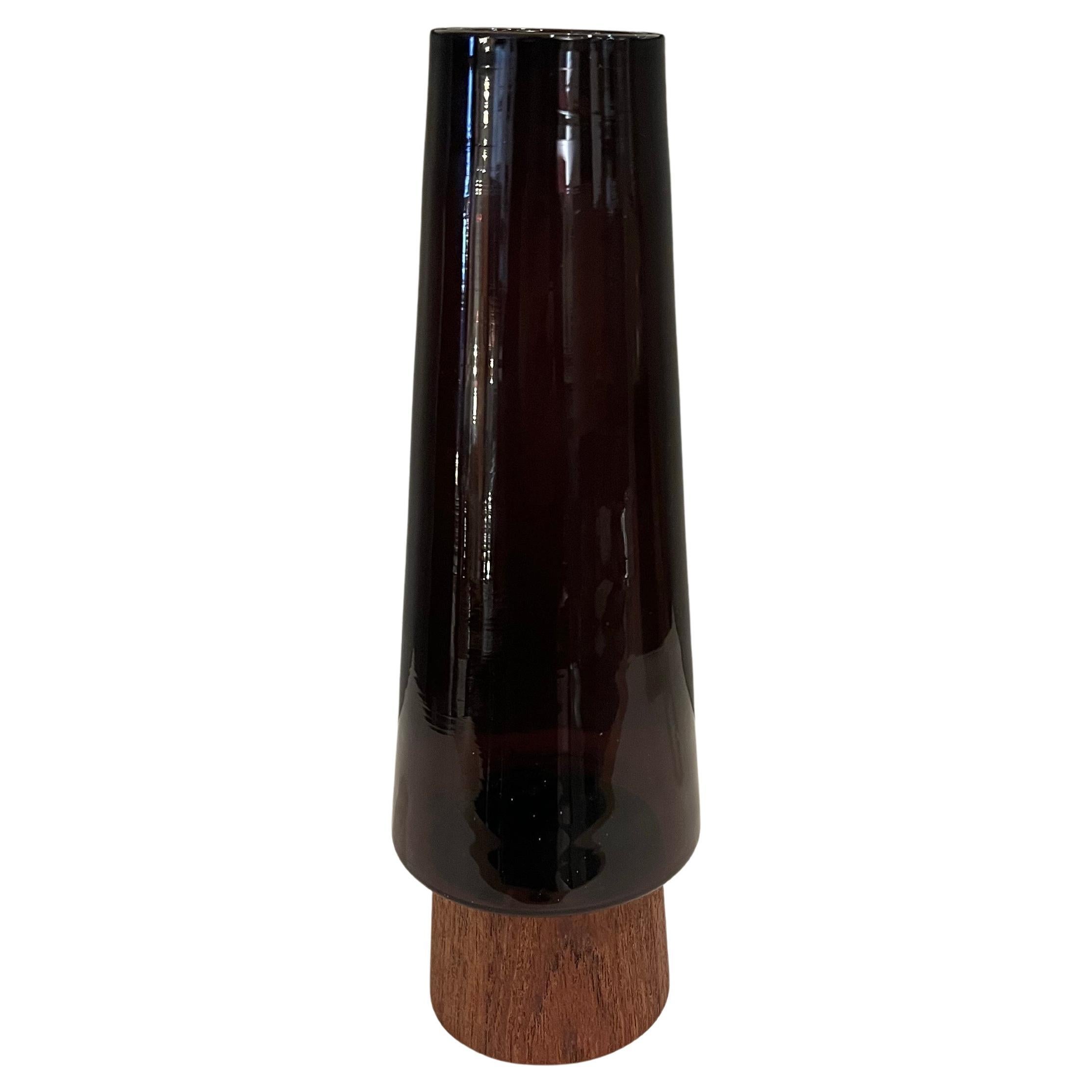 Beautiful and very rare solid teak base with beautiful elegant pine shaped glass in a purple color , circa 1950's stamped Denmark , excellent condition with a small hair line crack on the bottom doesnt affect and is barely visible.
