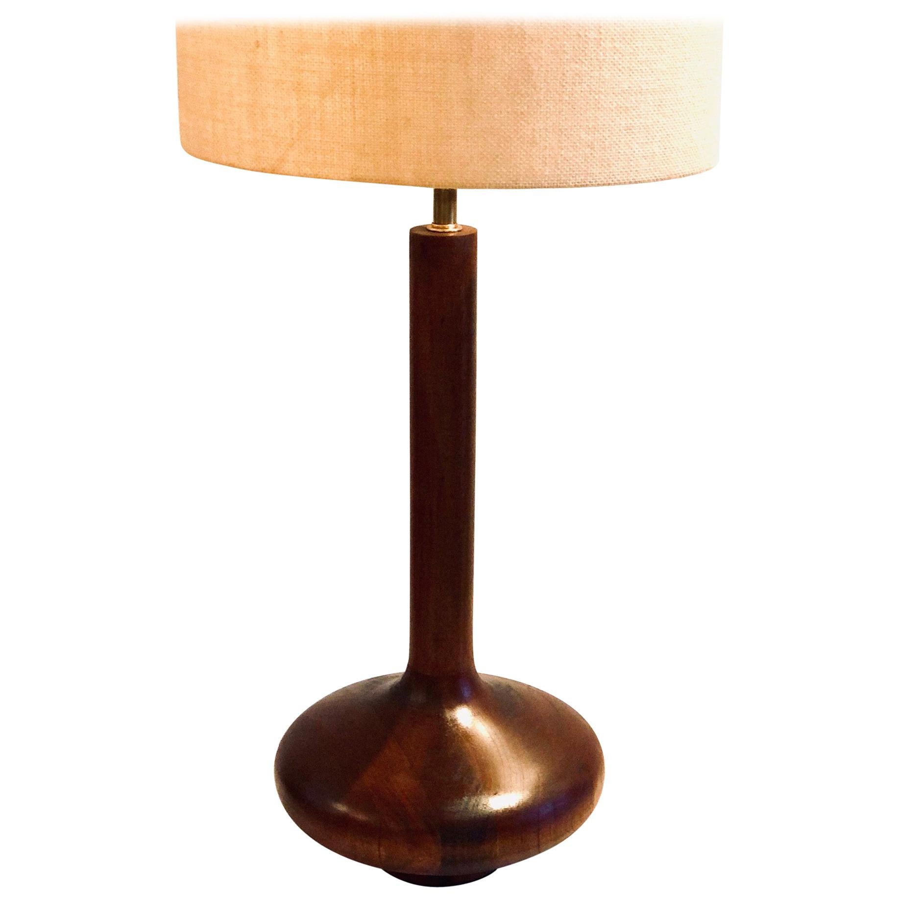 Beautiful single solid teak table lamp, bulbous sculptural base, rewired and refinished great condition, circa 1960s. Nice brass socket and cloth cord, lampshade it's not included. The lamp its 35