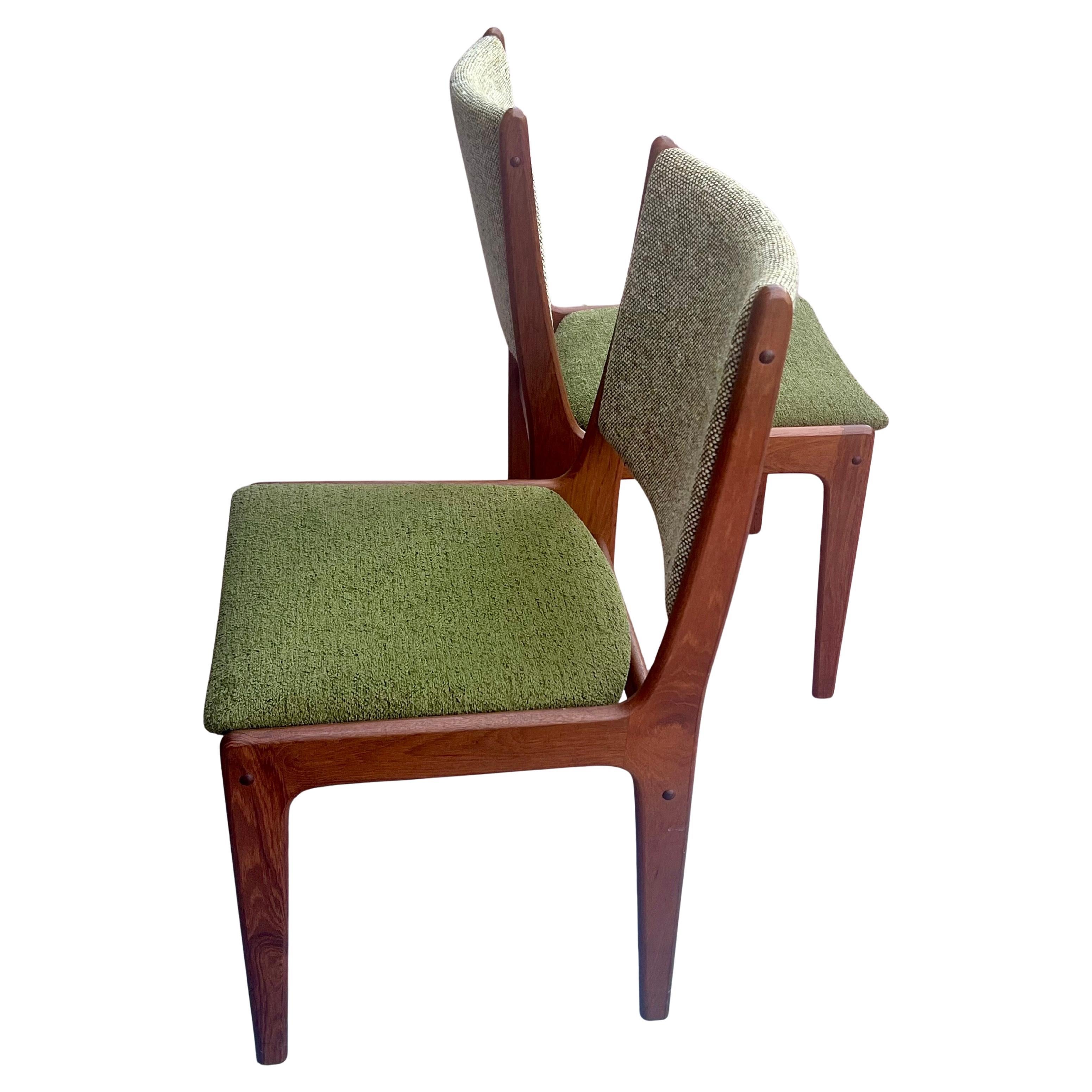 Beautiful elegant solid teak sculpted set of 4 chairs, designed by Johannes Andersen all original condition finish and back fabric solid and sturdy, we have recover the seat part only with Mohair we left the original back fabric to add a nice bitone