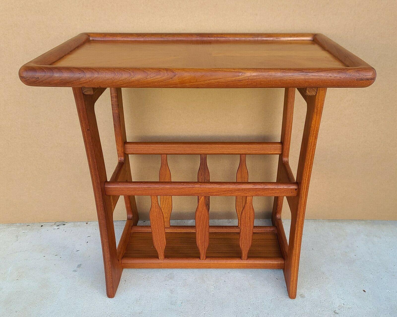 Offering One Of Our Recent Palm Beach Estate Fine Furniture Acquisitions Of A 
Vintage MCM Danish Modern Solid Teak Side End Table with Magazine Holder by GOODWOOD

Approximate Measurements in Inches
21.75