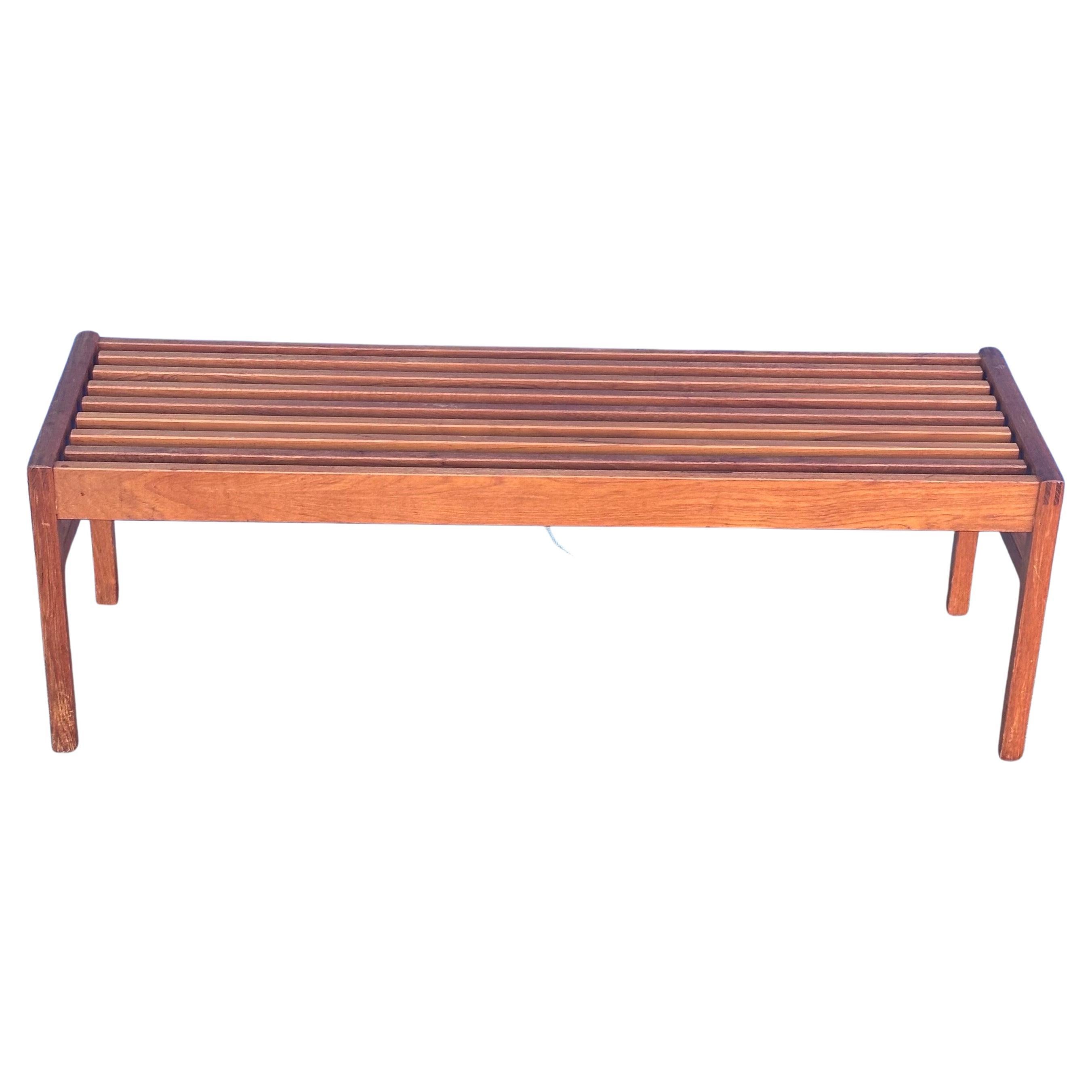 Gorgeous Danish modern solid teak slat bench / coffee table by Lysgaard Mobler, circa 1960s.  The bench is in very good vintage condition and measures 49.75