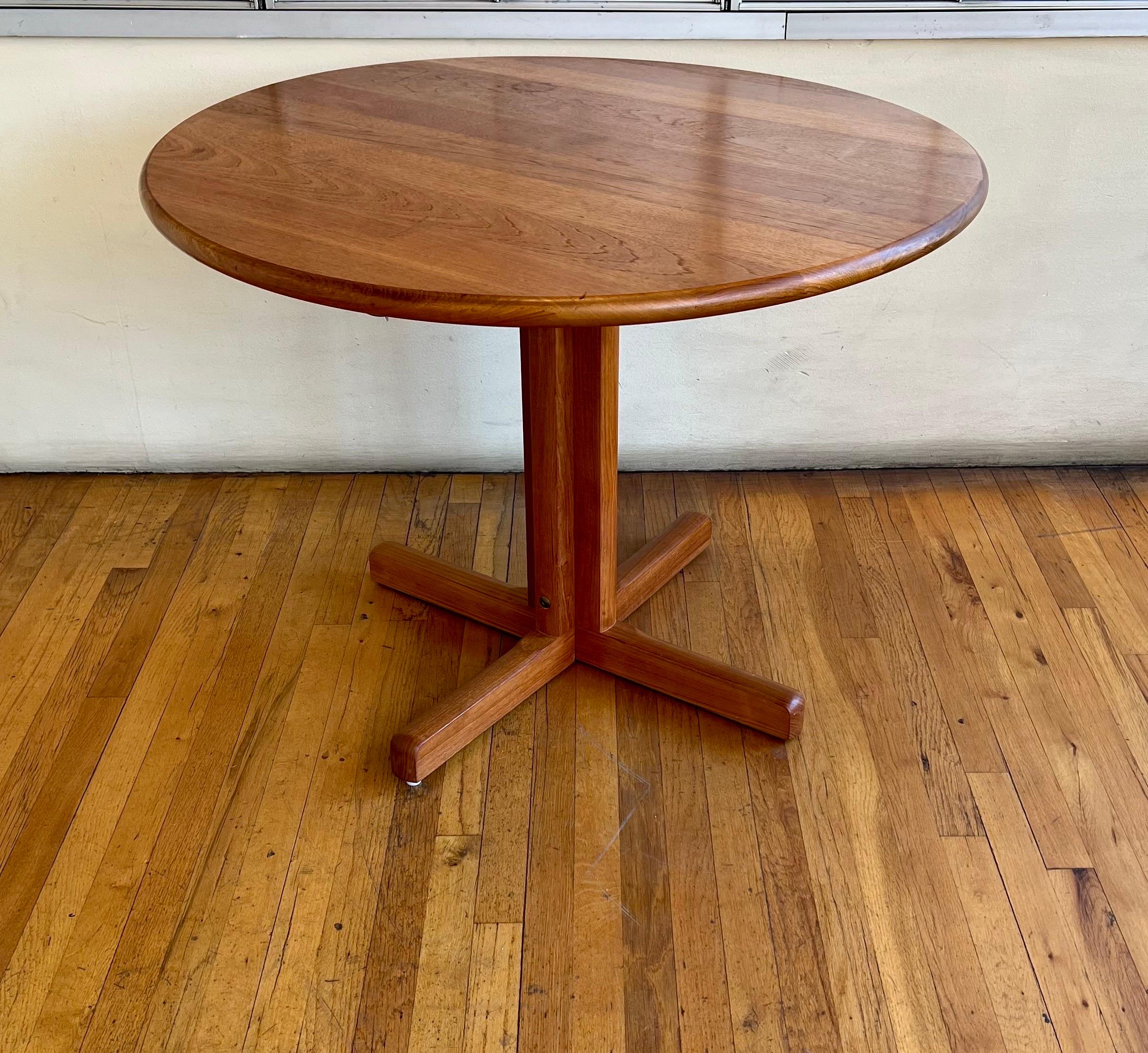 Beautiful simple elegant design on this solid teak small dining table, designed by Erik Ole Jorgensen, circa the 1980s, freshly refinished the table top comes off for easy shipping. freshly refinished in great condition.