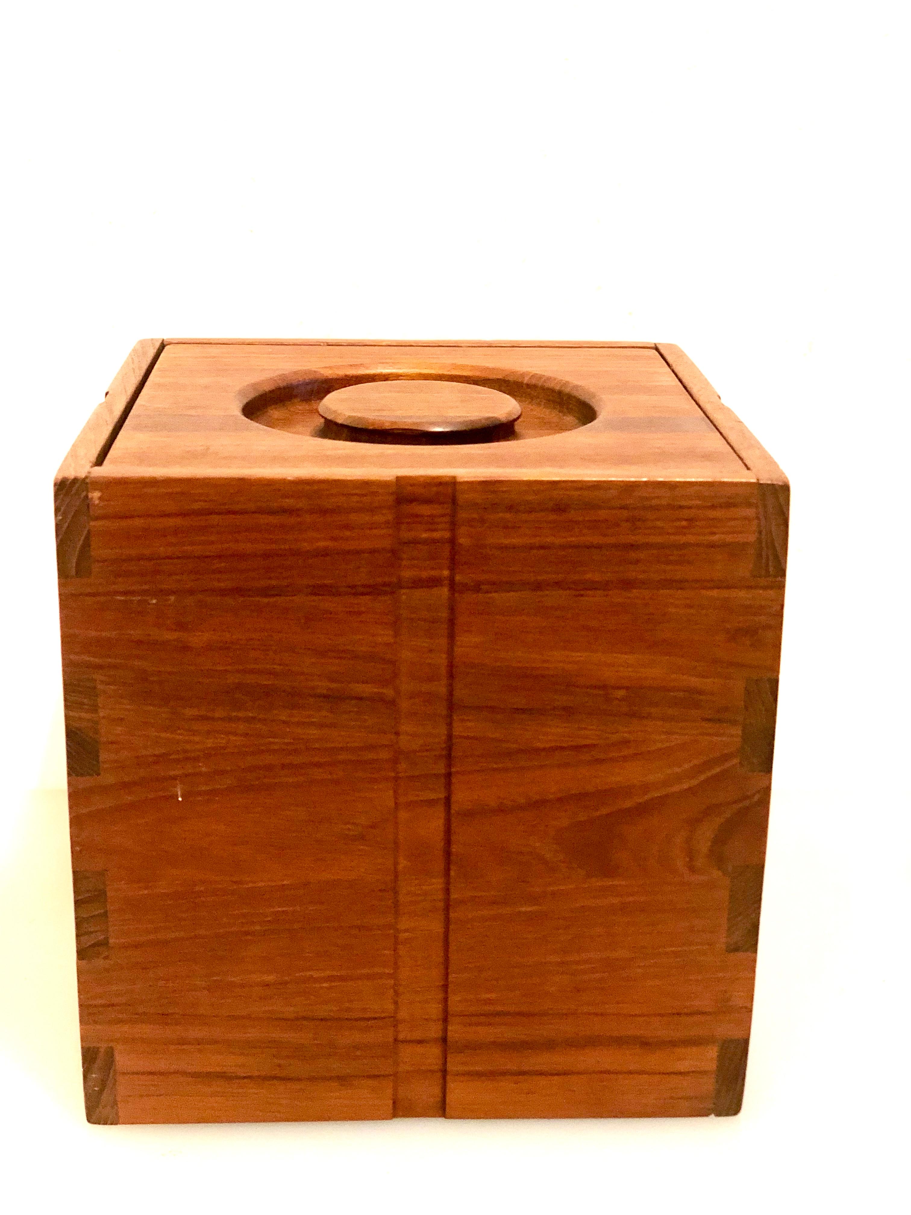 Beautiful craftsmanship solid teak dovetail joint in this simple and elegant, ice bucket with plastic liner freshly refinished and in great condition.