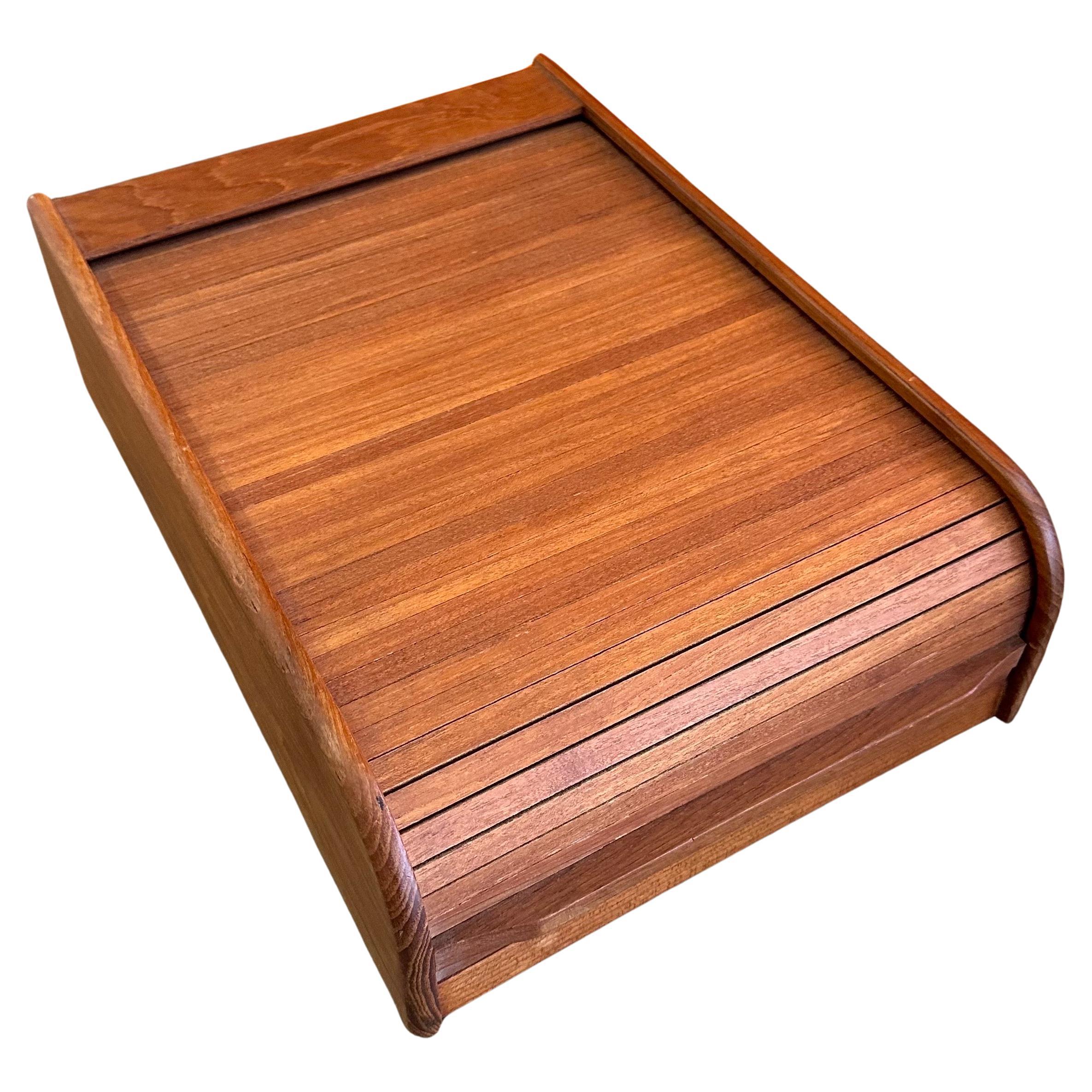 Danish modern solid teak tambour door trinket box, circa 1970s.  This beautiful well crafted desk top box is great for storing small items. The box is in very good vintage condition and measures 10