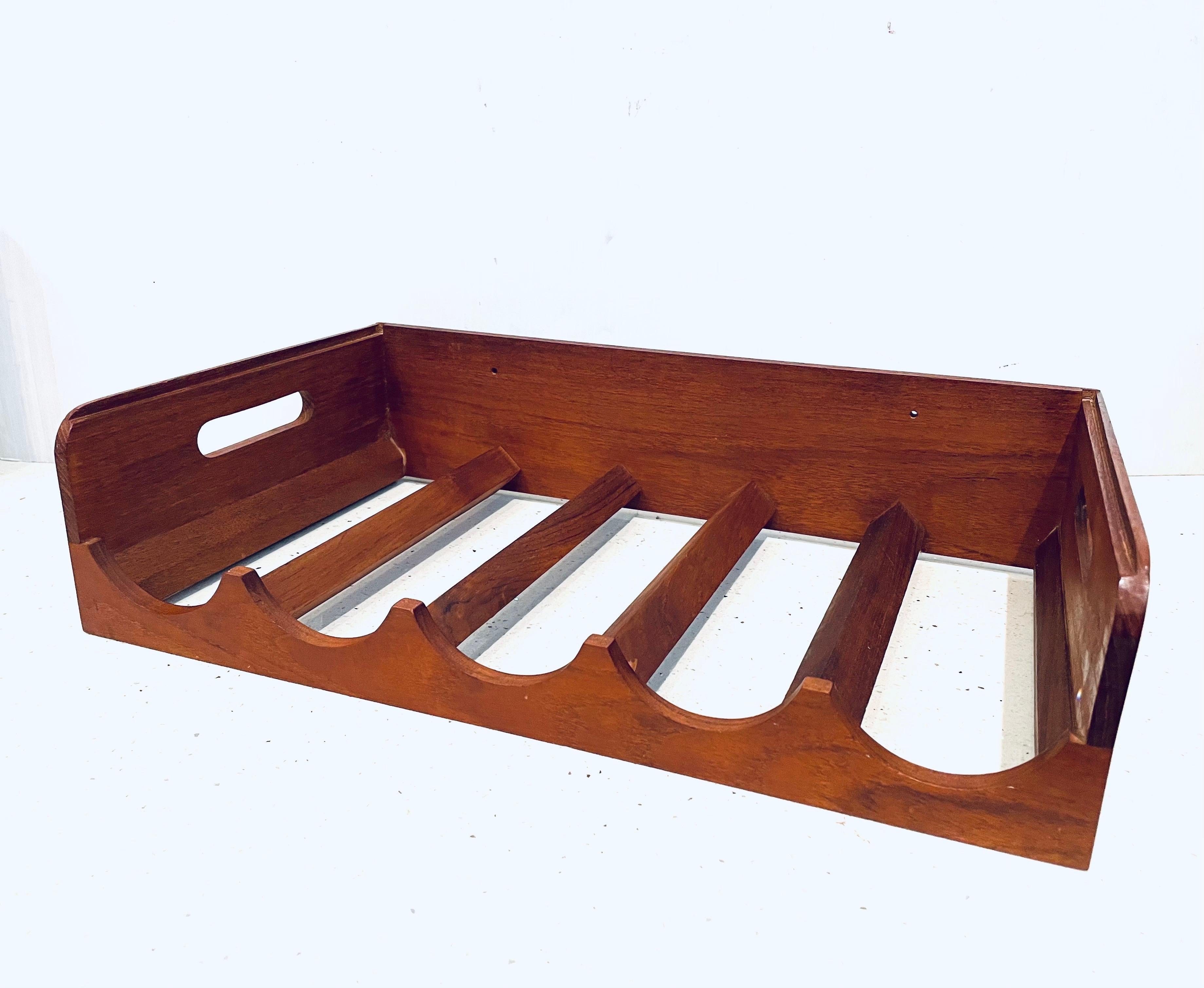 Beautiful simple handcrafted wine rack in solid teak 5 bottle capacity, circa the 1970s. With side handles.