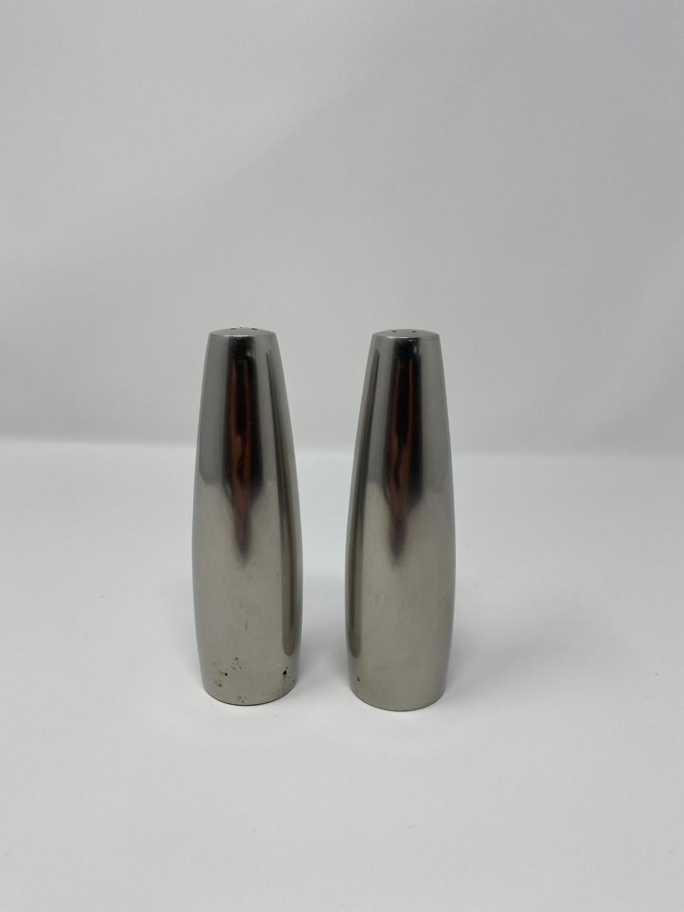 Beautiful pair of vintage Danish modern salt and pepper shakers from Dansk design. Timeless design in stainless steel. A great addition of midcentury design to your décor.