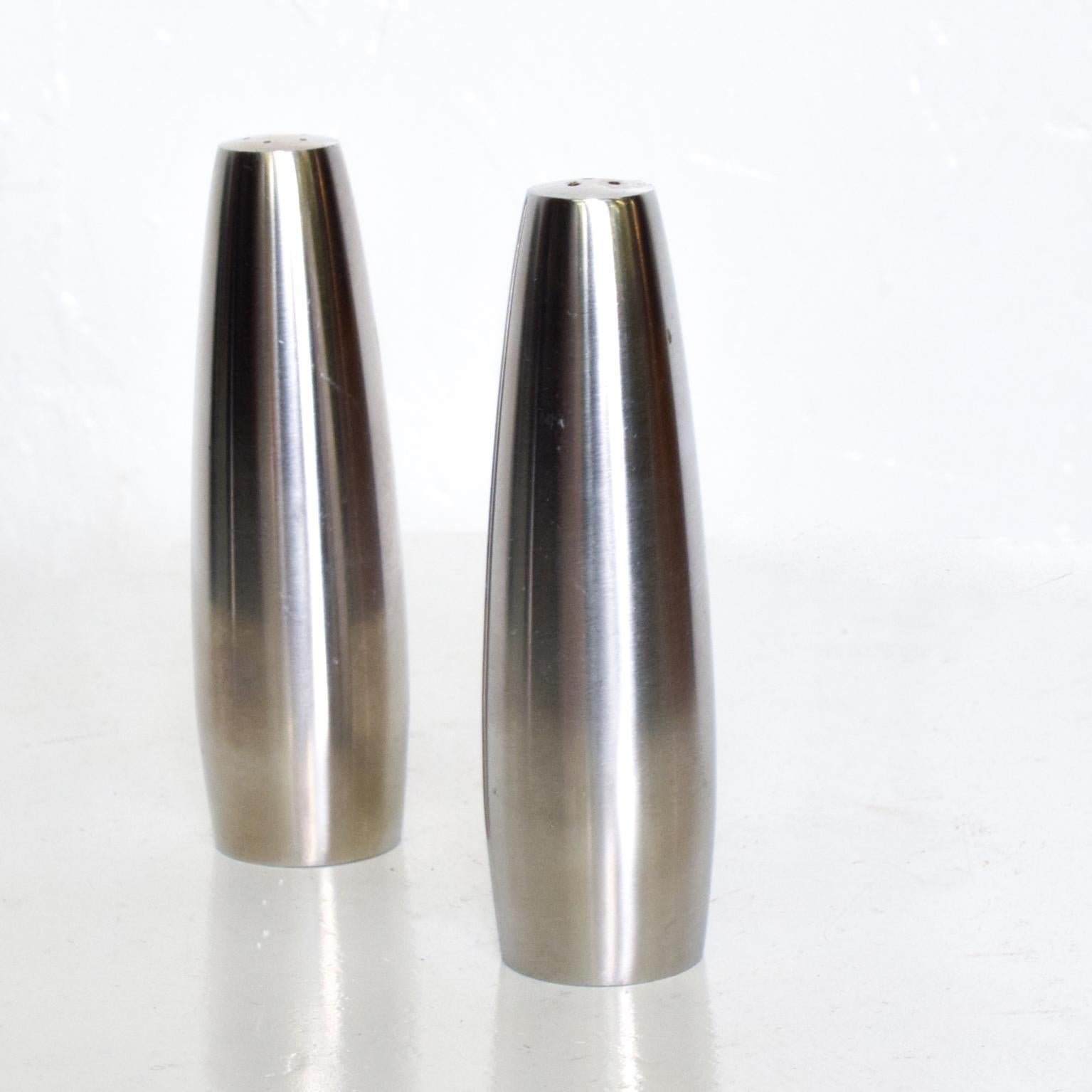 For your consideration, a set of salt & pepper shakers, Danish modern stainless steel salt & pepper shakers. Stamped: DANSK DESIGN, IHQ DANMARK. Dimensions: 4 3/4