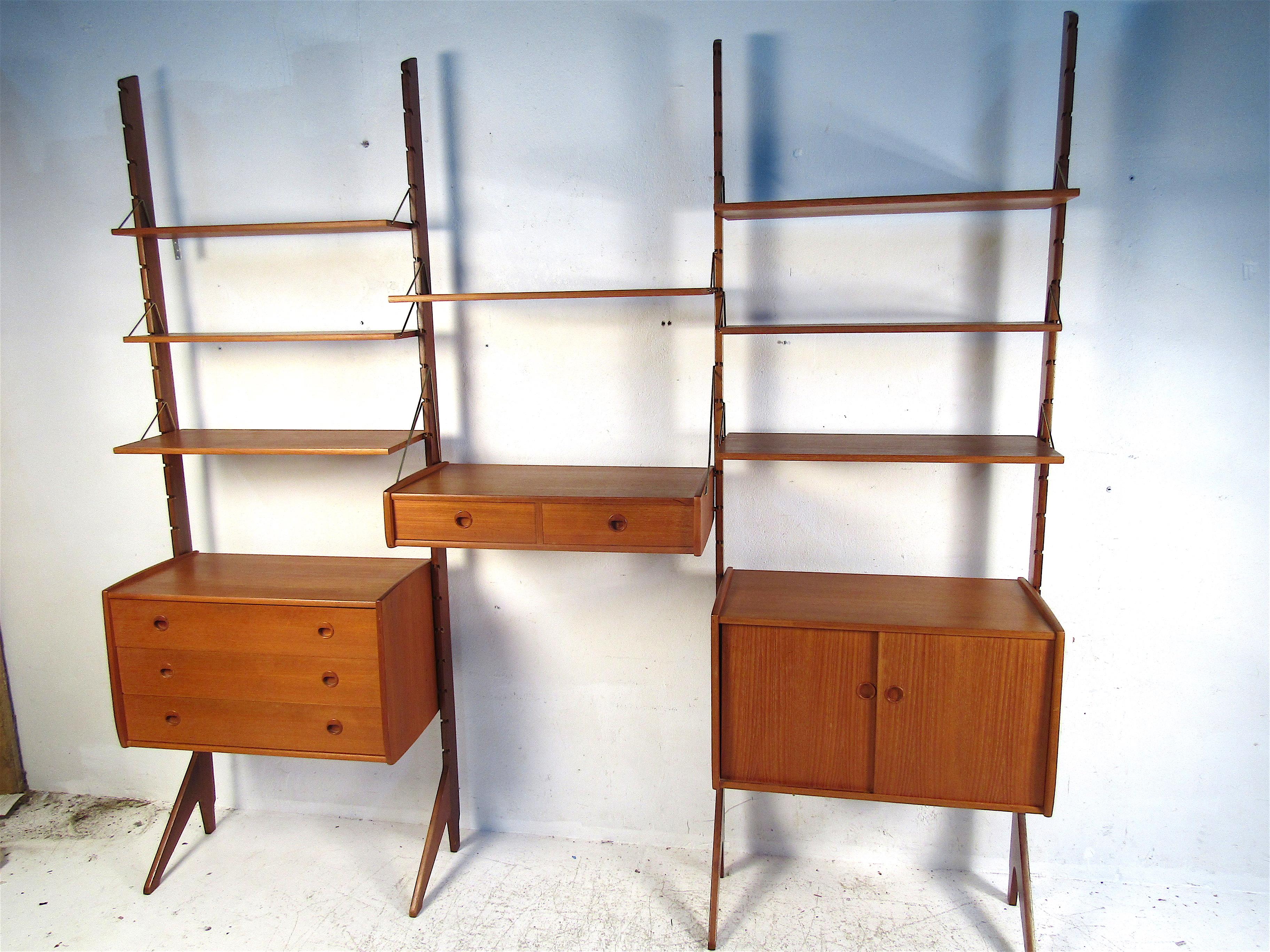 Very nice Danish modern standing wall unit with adjustable components. Assorted cases and shelves provide ample storage/display space and can be set up to your liking. Please confirm item location with dealer (NJ or NY).