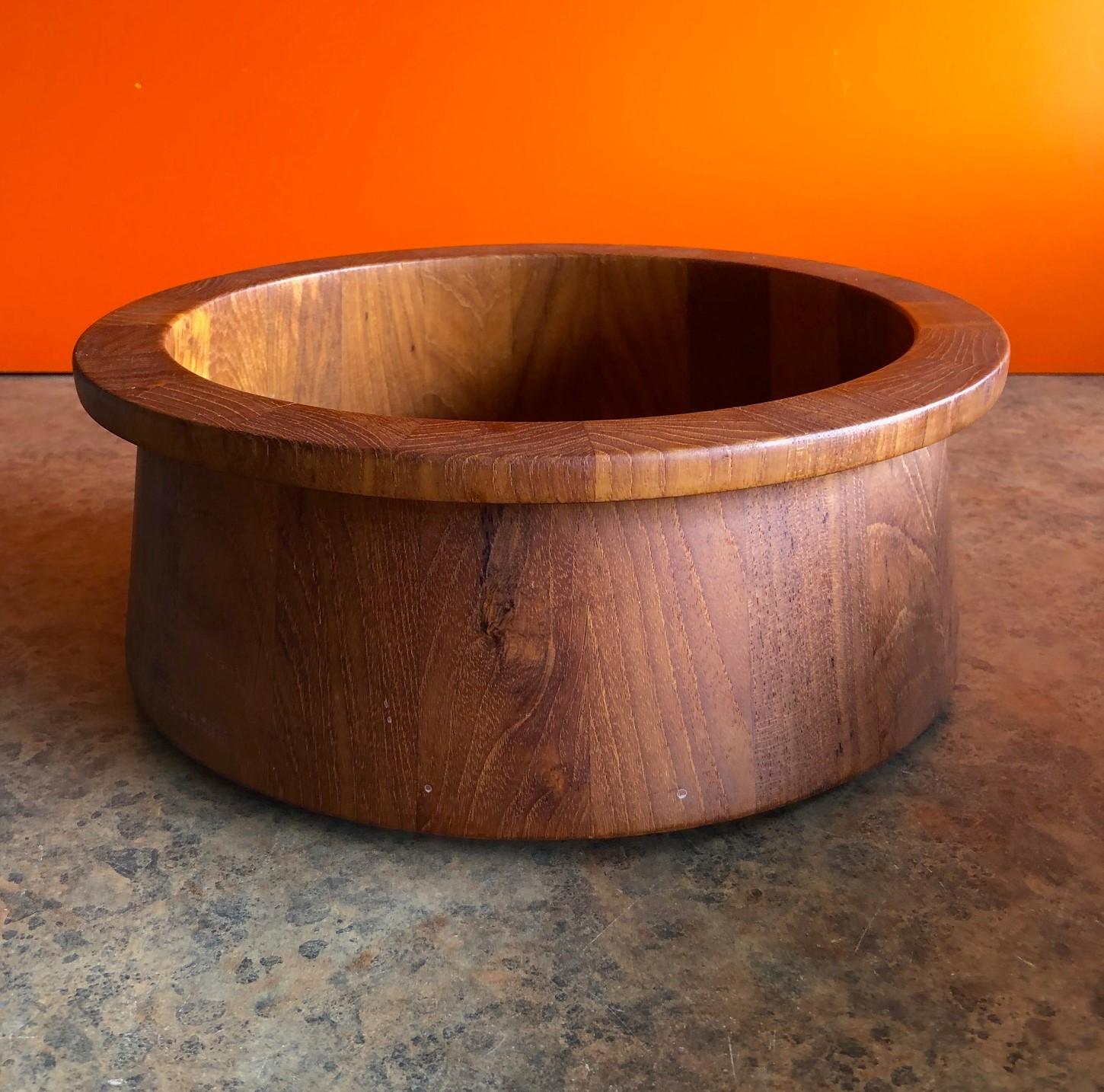 A very nice Danish modern staved teak bowl by Jens Quistgaard for Dansk, circa 1970s. The bowl is 11.5