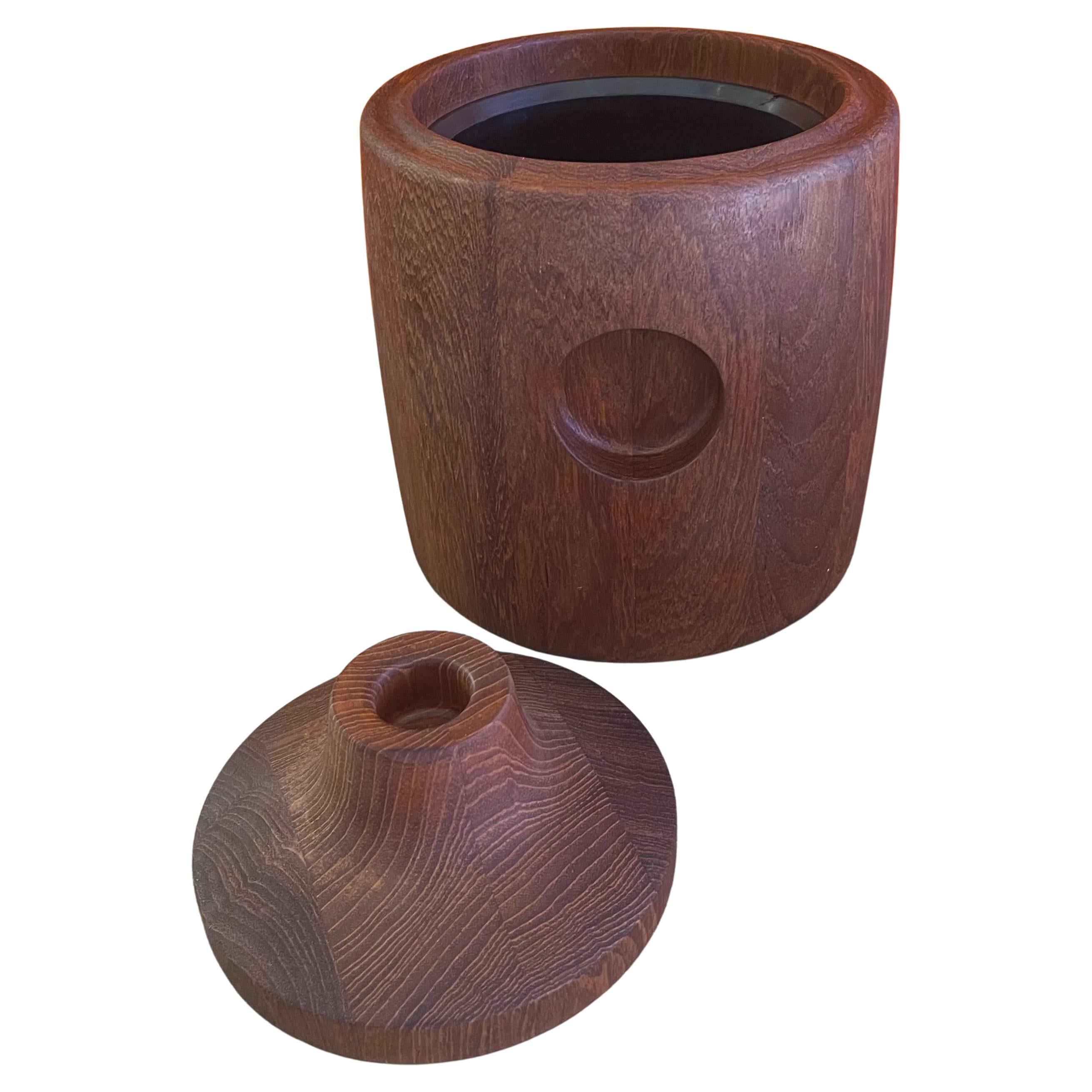 Beautiful Danish modern staved teak ice bucket by Henning Koppel for George Jensen, circa 1950s. The bucket is in very good vintage condition and measures 8.5