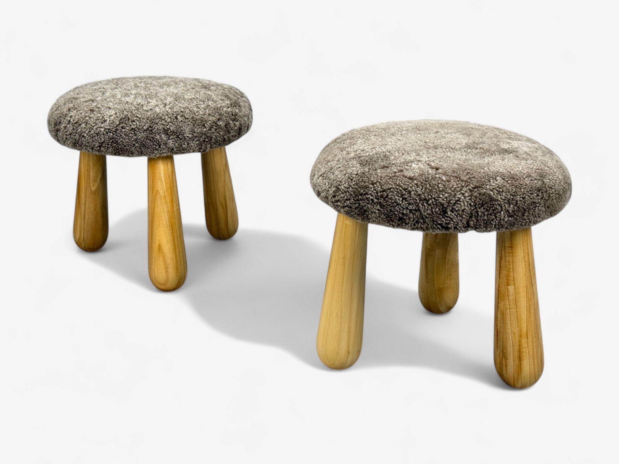 Danish Modern Style, Brown Sahara Sheepskin, Maple, Shearling Footstools, USA, 21st c.

A one-of-a-kind pair of handcrafted tripod ottomans inspired by Nordic and Swedish modern design. Each piece features hand-stained maple legs with sculptural,