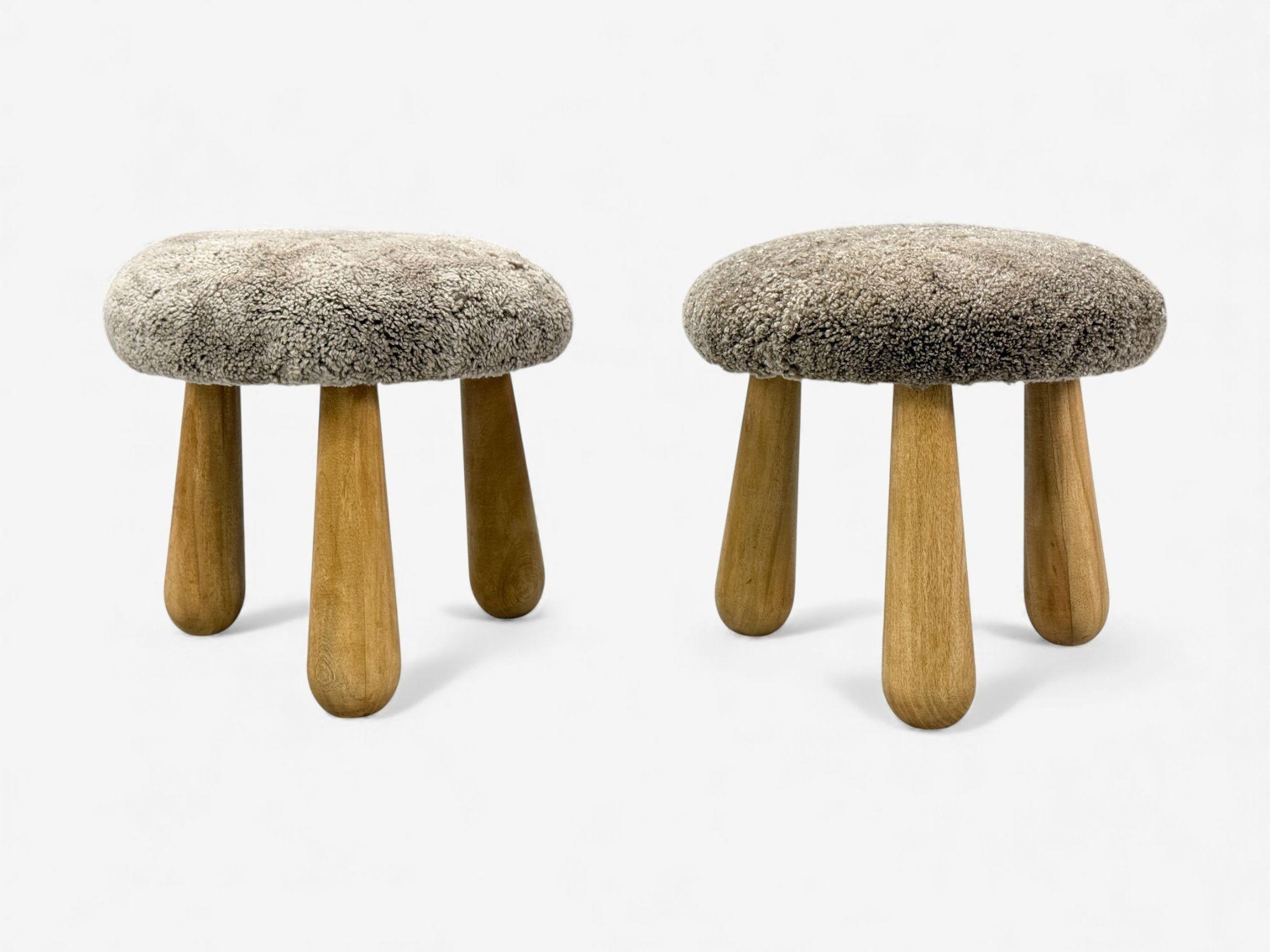 Danish Modern Style, Gray Sahara Sheepskin, Maple, Shearling Footstools or Ottomans, USA, 21st c.

A one-of-a-kind pair of handcrafted tripod ottomans inspired by Nordic and Swedish modern design. Each piece features hand-stained maple legs with