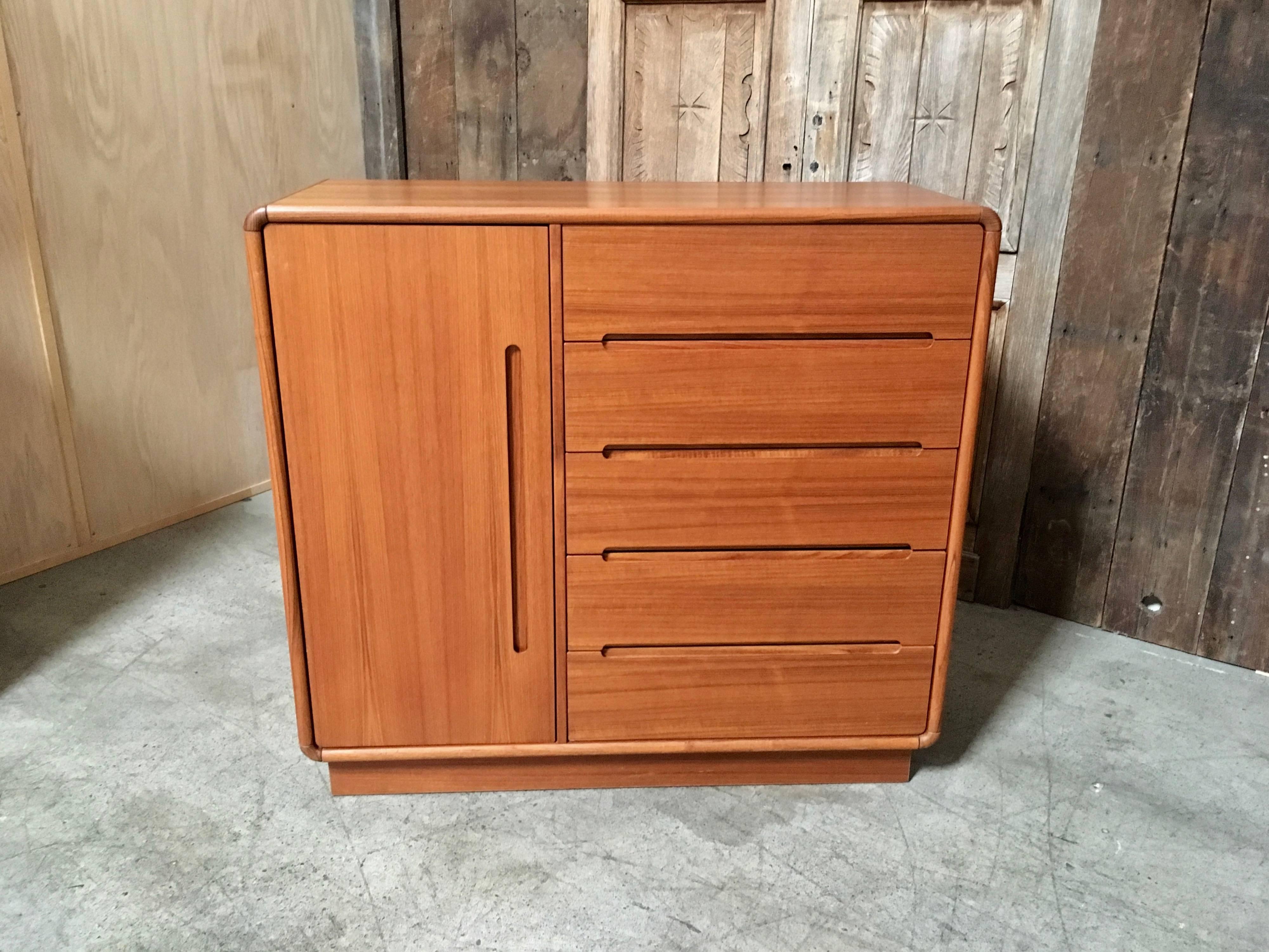 Very practical armoire with five drawers on the right side and two more jewelry drawers inside the doored section with two shelves.
