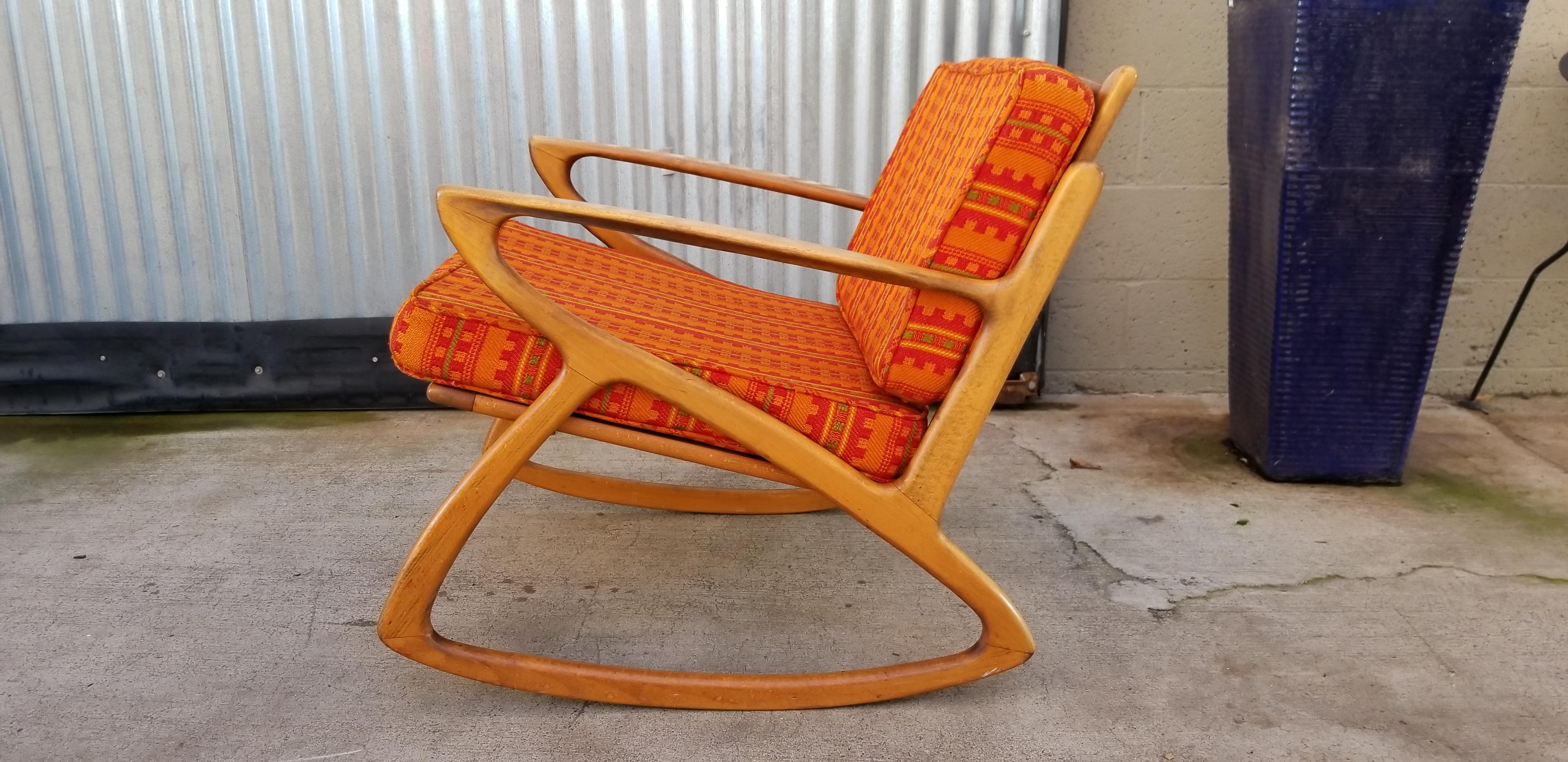 Exceptional architectural sculptured wood design to this Mid-Century Modern rocking chair. Danish Modern style crafted in Italy, 1950s. Appears to be made of beechwood. Chair has design elements similar to that of Adrian Pearsall. Seat height