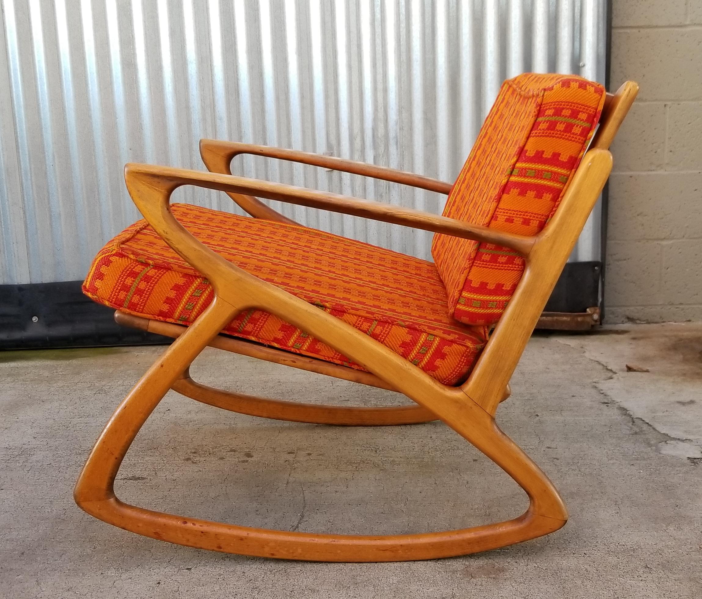 Exceptional architectural sculptured wood design to this Mid-Century Modern rocking chair. Danish modern style crafted in Italy, 1950s. Appears to be made of beechwood. Chair has design elements similar to that of Adrian Pearsall. Seat height