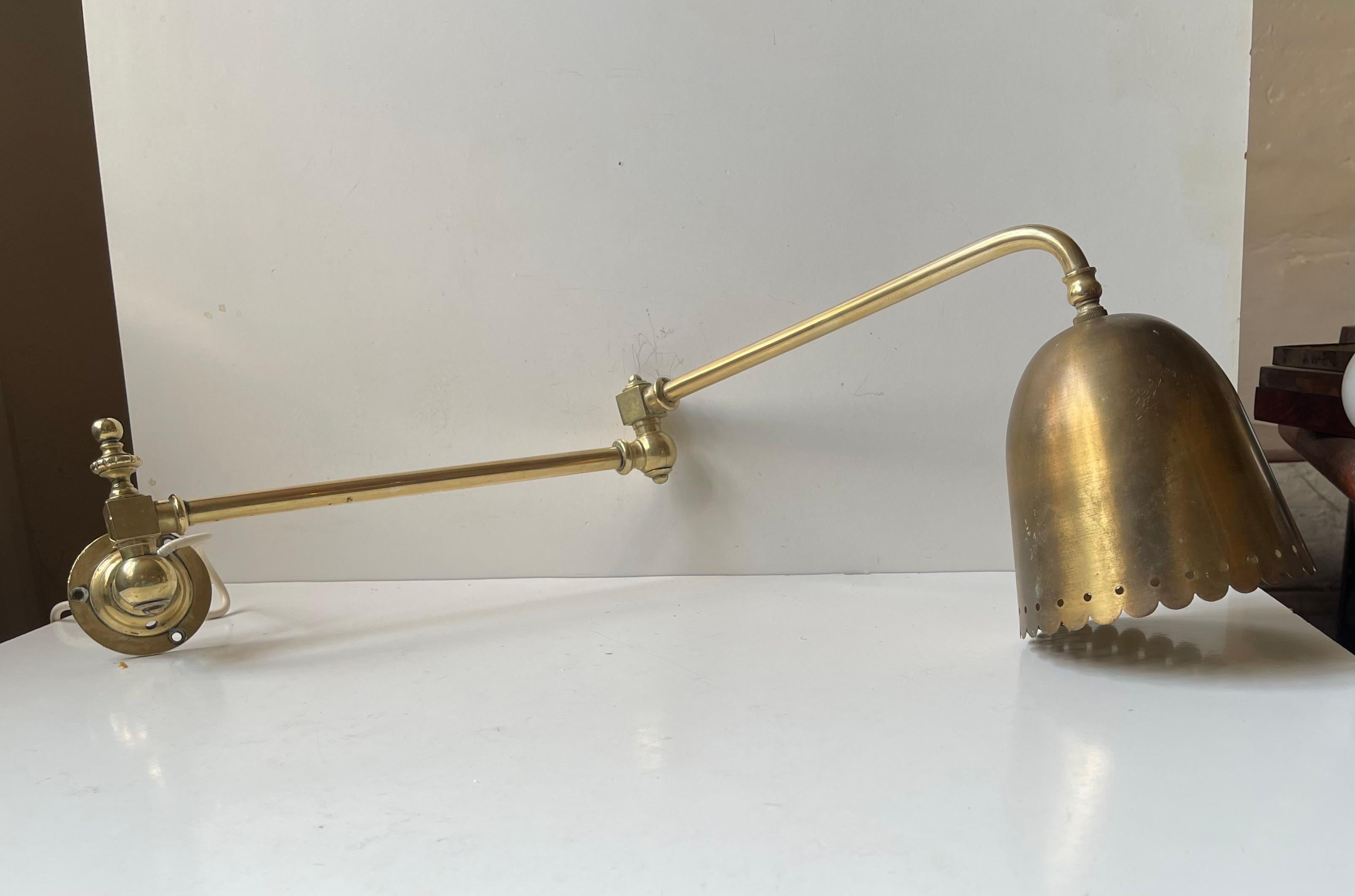 Adjustable wall lamp - angle-poise Sconce made entirely from brass. It's adjustable to both sides, in dept/reach - in between the two arms and at the mount/base. It was designed by Svend aage Holm Sørensen and probably made by ASEA in Sweden during