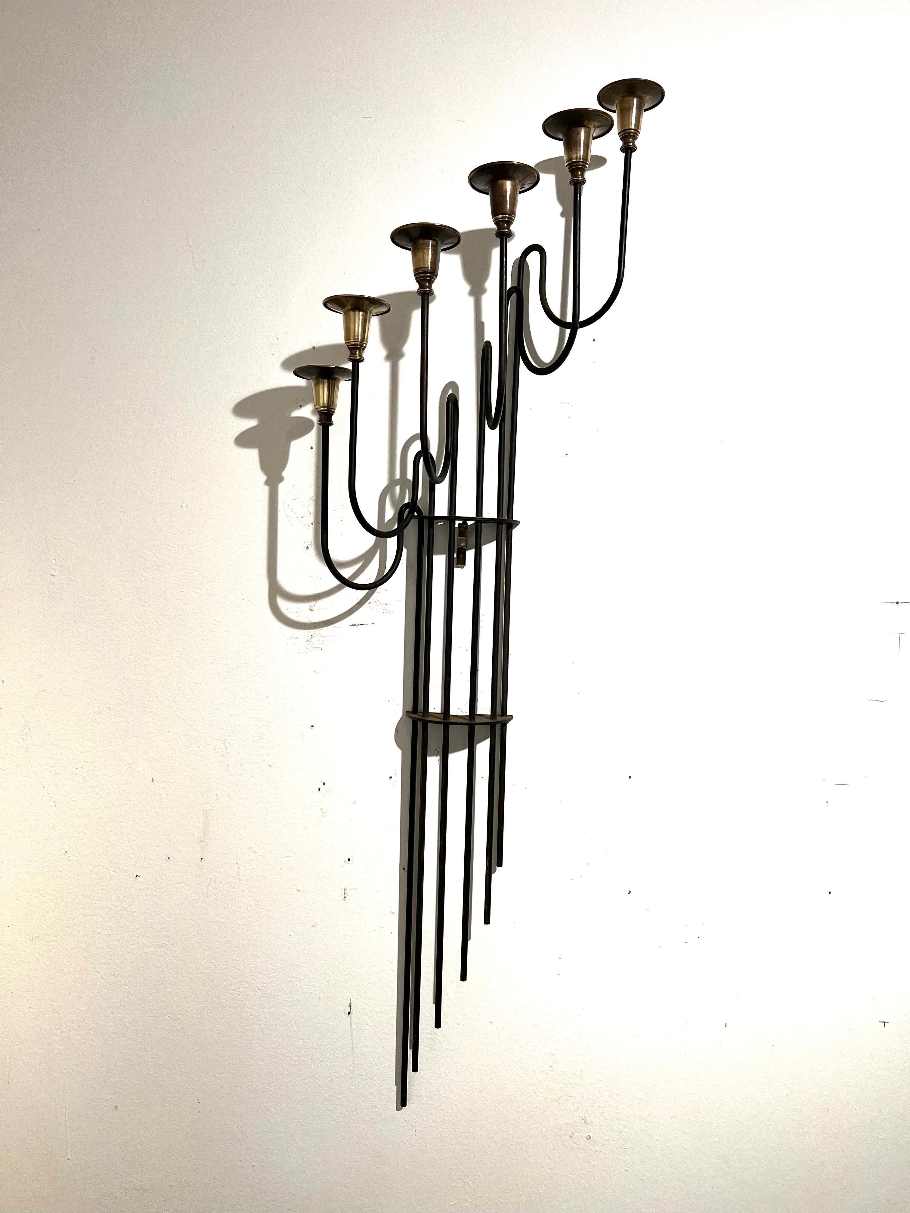 A large iron wall candle sconce with brass fittings. Patinated brass each tip comes off for cleaning and polishing incredible craftsmanship beautiful rare piece.