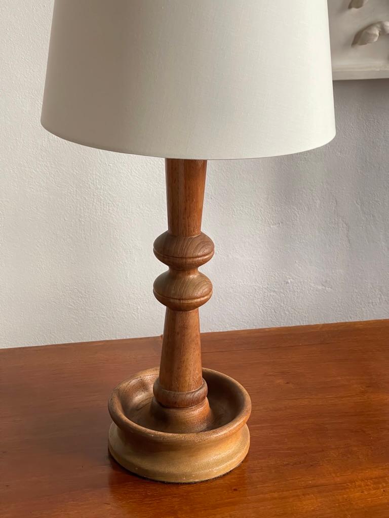Scandinavian Modern Danish modern table lamp in one solid piece of carved teak wood. Denmark 1950s For Sale