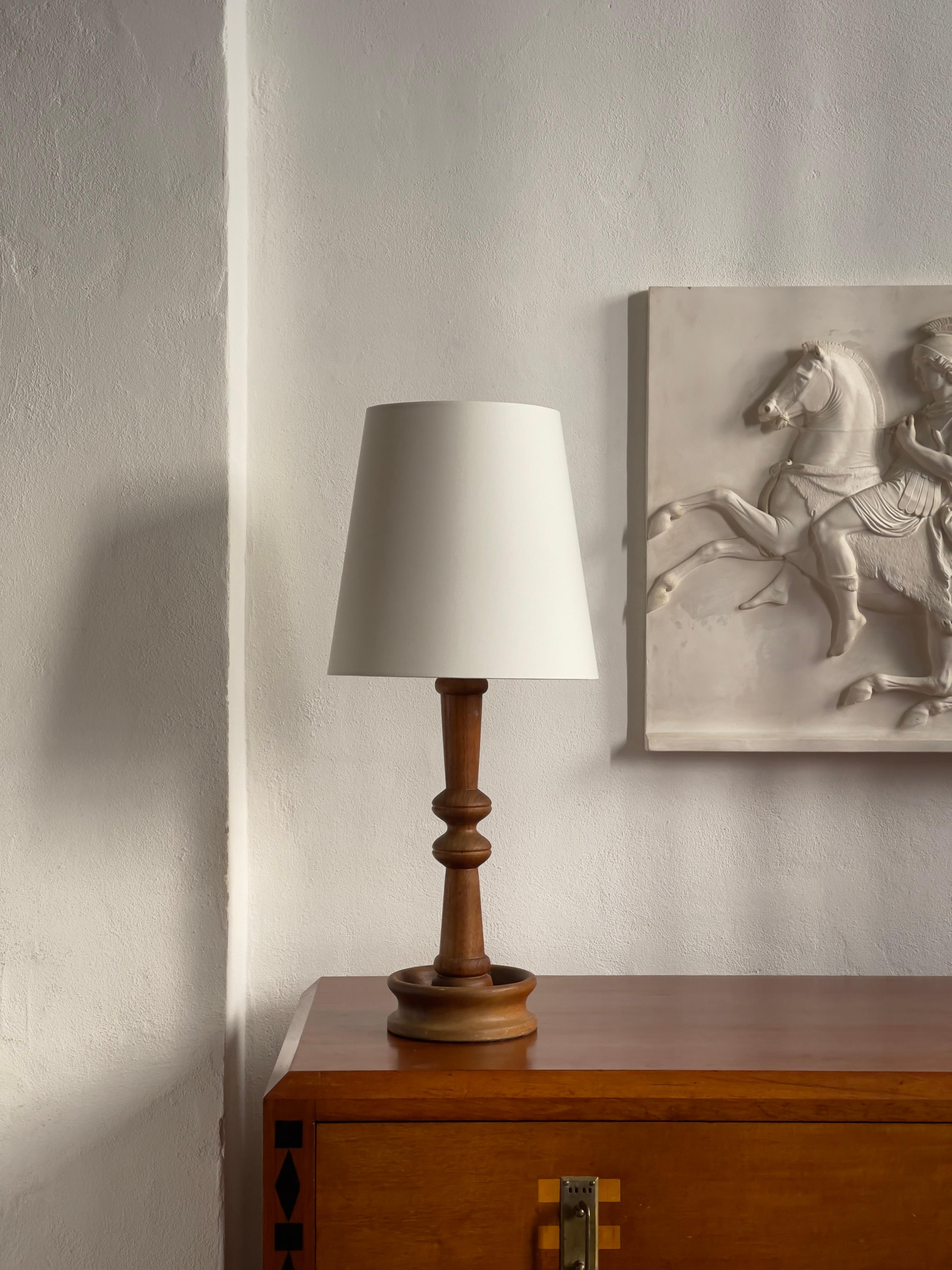 Original danish modern table lamp  hand carved in one piece solid teak wood. Beautiful grain and elegant curved shapes and proportions. Will provide a warm and natural feeling to your interior design. 
Dresser is also available - See other listings.